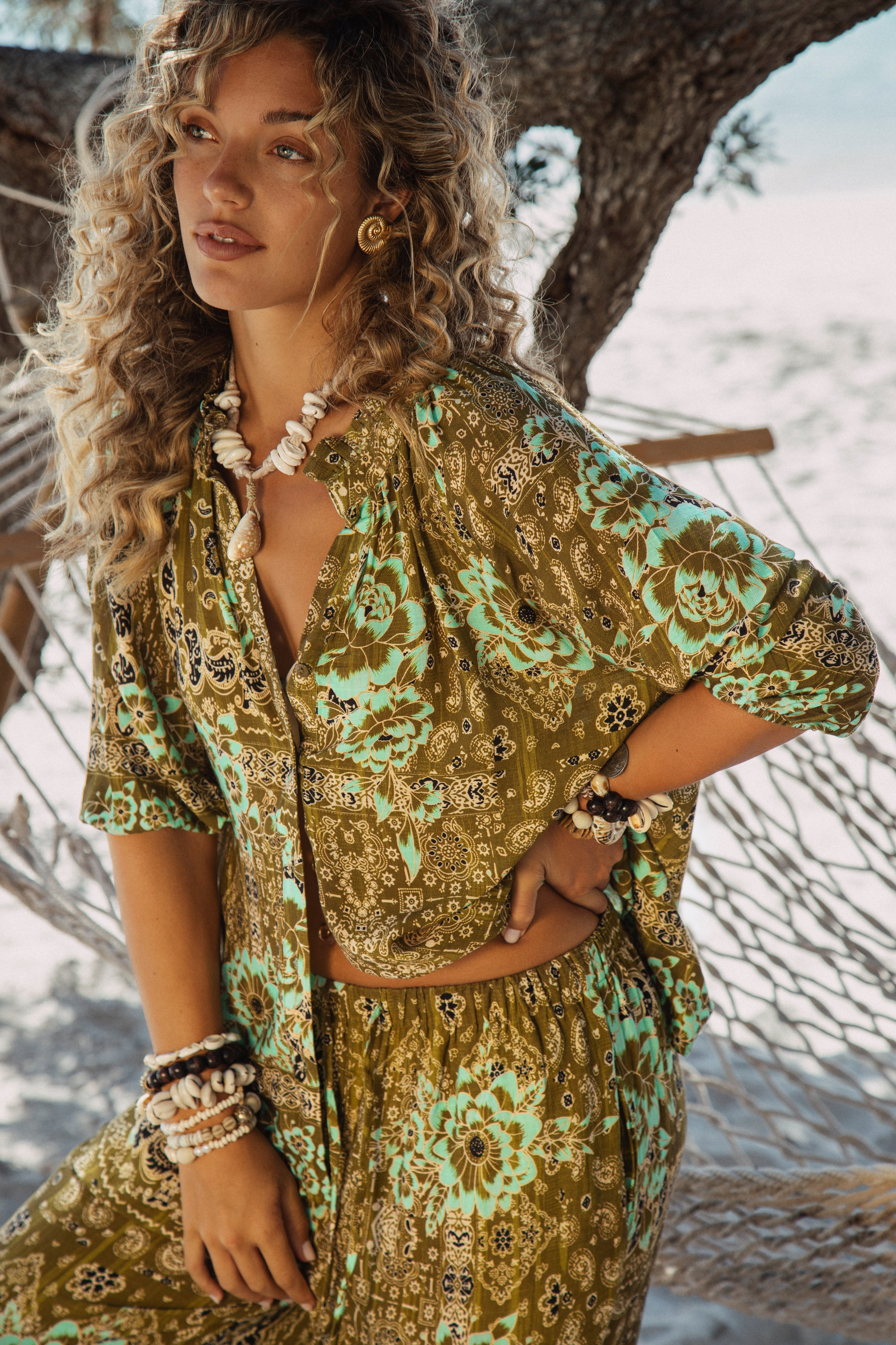 Paradise Found Blouse features a floral paisley Boho inspired print in shades of khaki and aqua