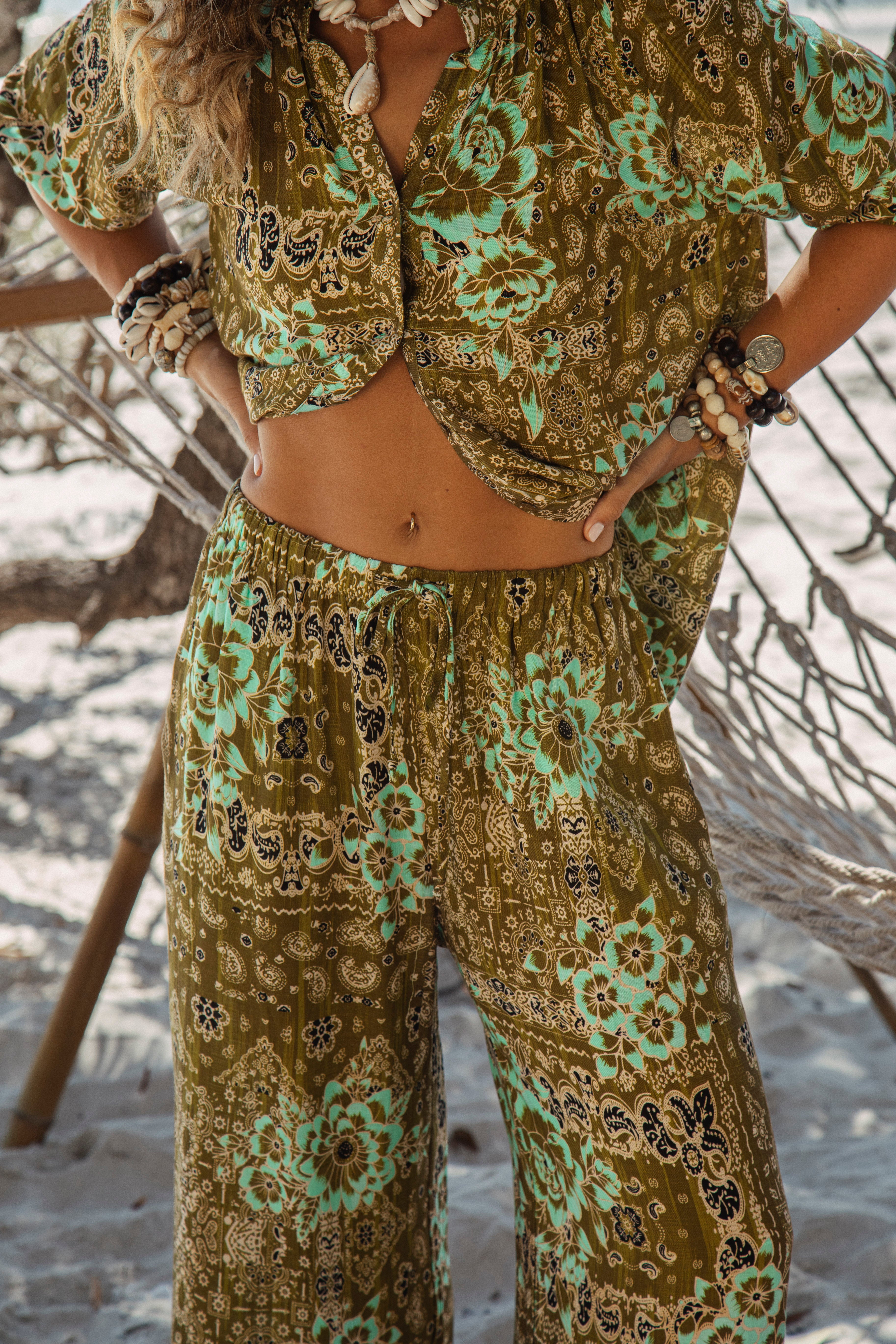 Paradise Found Pant is a relaxed style pant featuring aqua and khaki floral paisley pattern