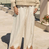 Alba Embroidered Linen Pants feature natural colourway with rust embroidery at hem in paisley Boho pattern