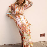 Amber Wrap Skirt Rio - featuring a ale pink colourway with vibrant boho paisley print