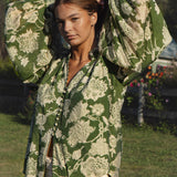 Aurora Blouse Evergreen - green blouse with floral print featuring billowy sleeves and ruched cuff.