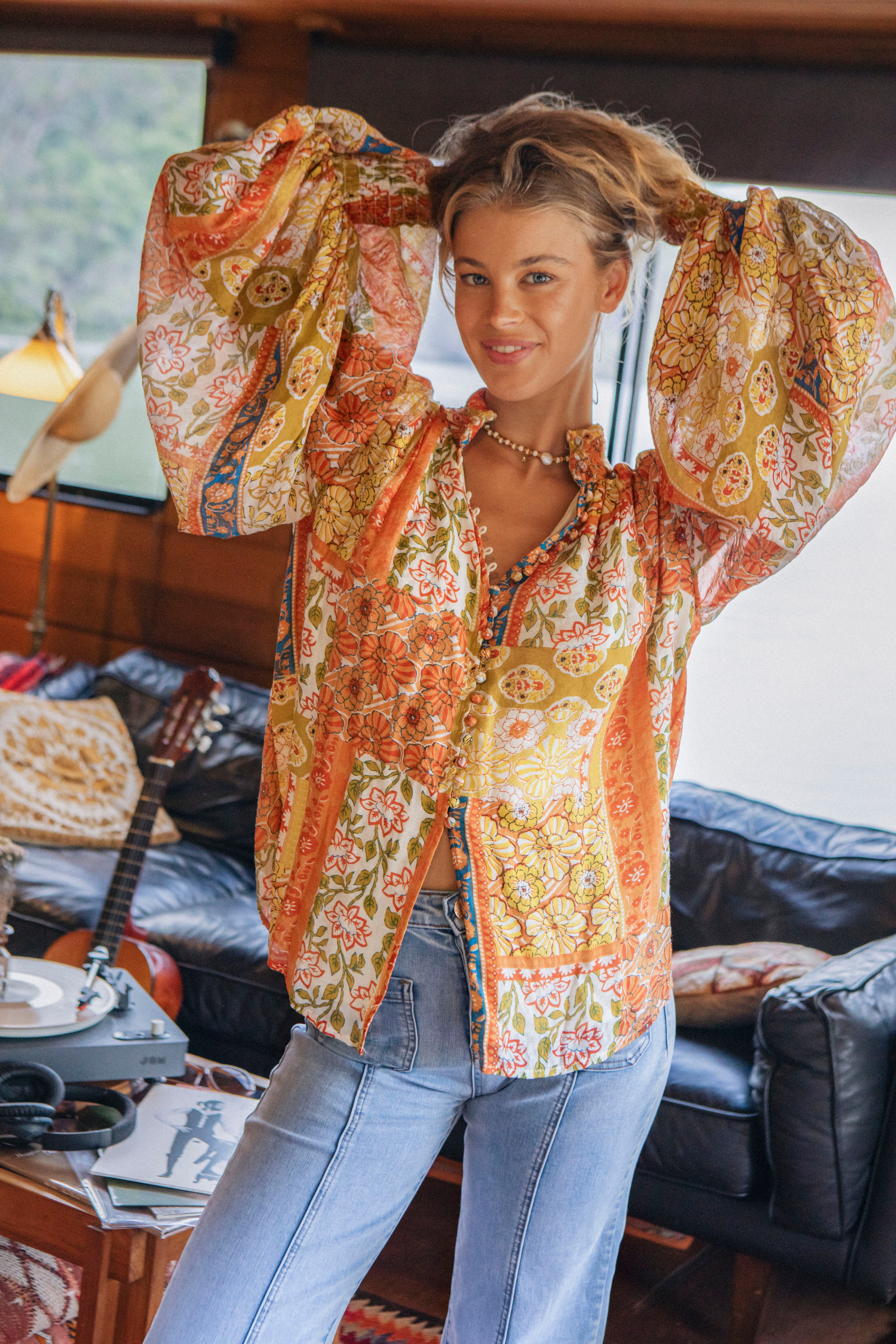 Aurora Blouse Gold Dust showcasing statement sleeves