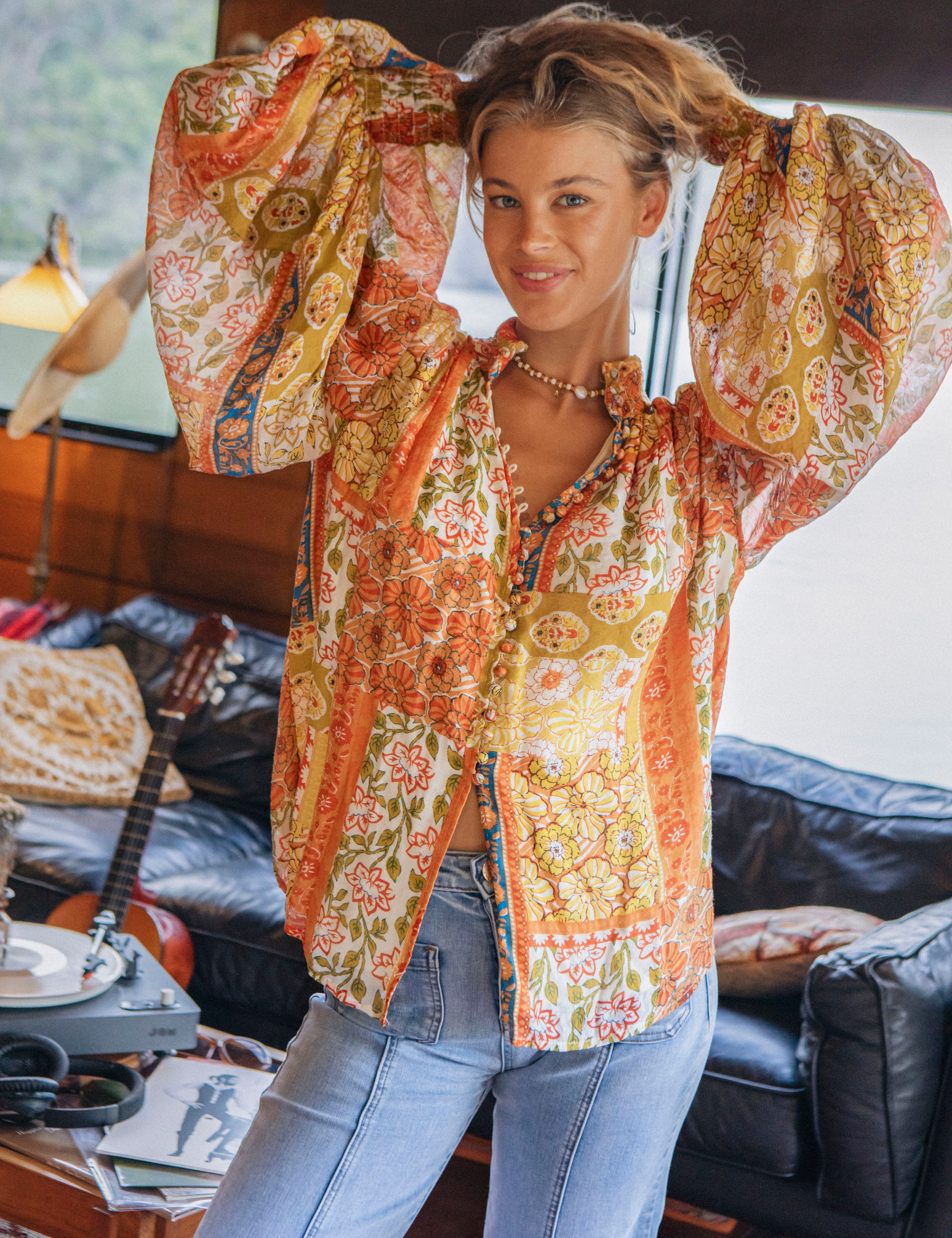 Aurora Blouse Gold Dust showcasing statement sleeves