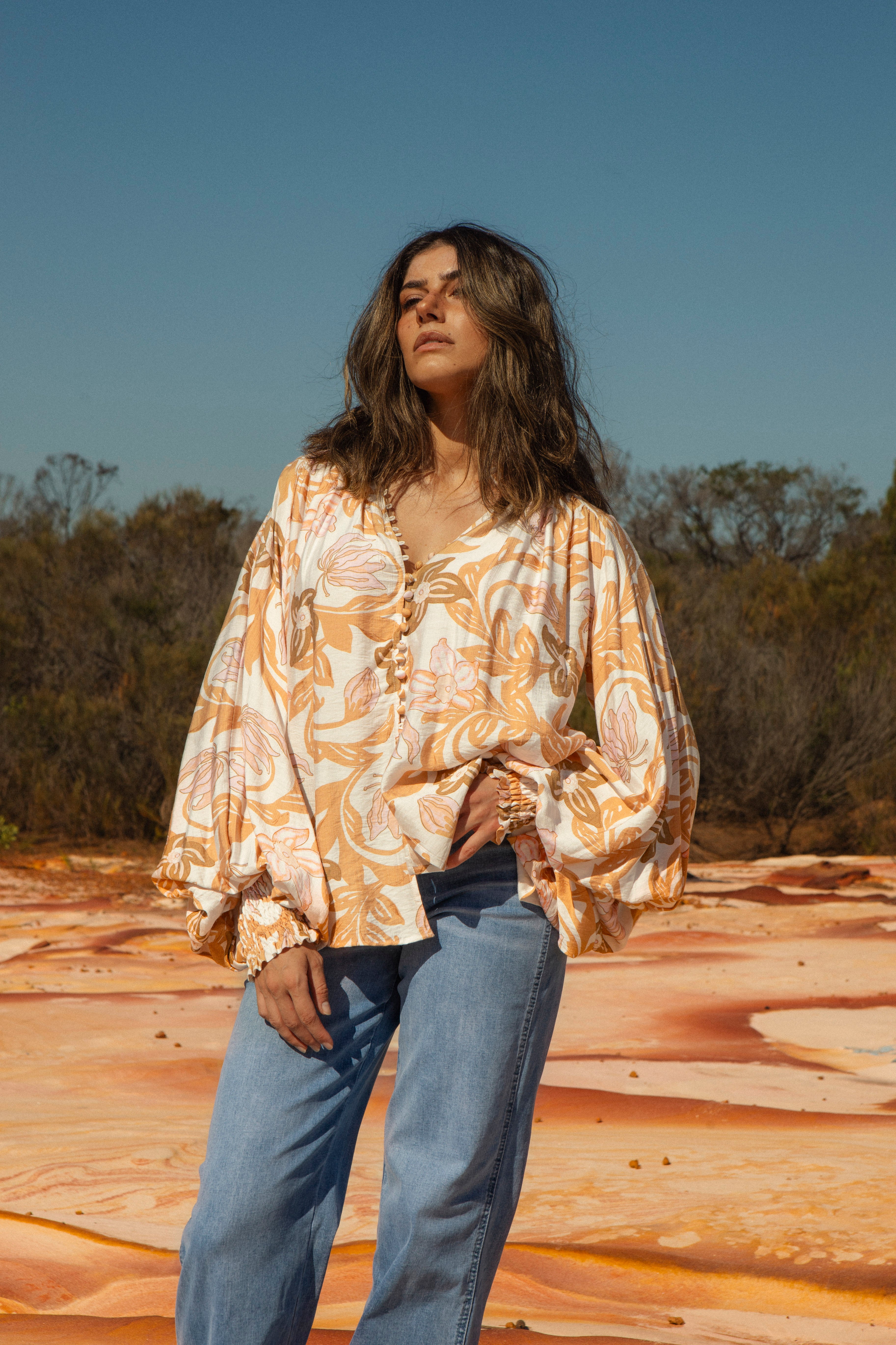 Aurora Blouse in Wildflower Honey print is a classic Boho style blouse featuring billowy sleeves and shirred cuffs.