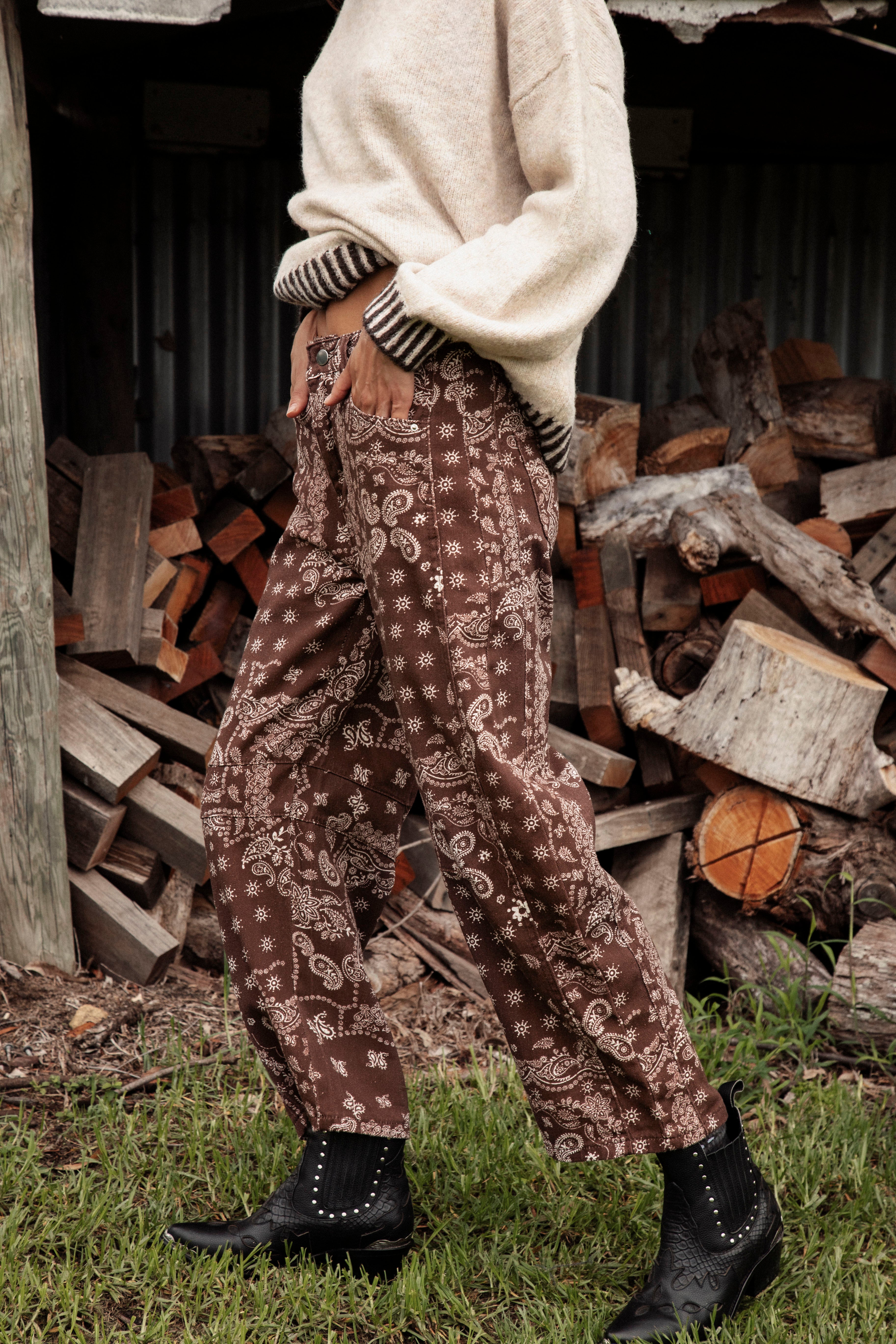 Bandit Barrel Jean is a brown pant featuring cream pattern in paisley bandana style.