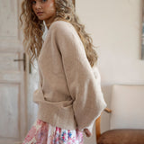 Belle Cross Over Knit showcasing crossover style and batwing sleeve