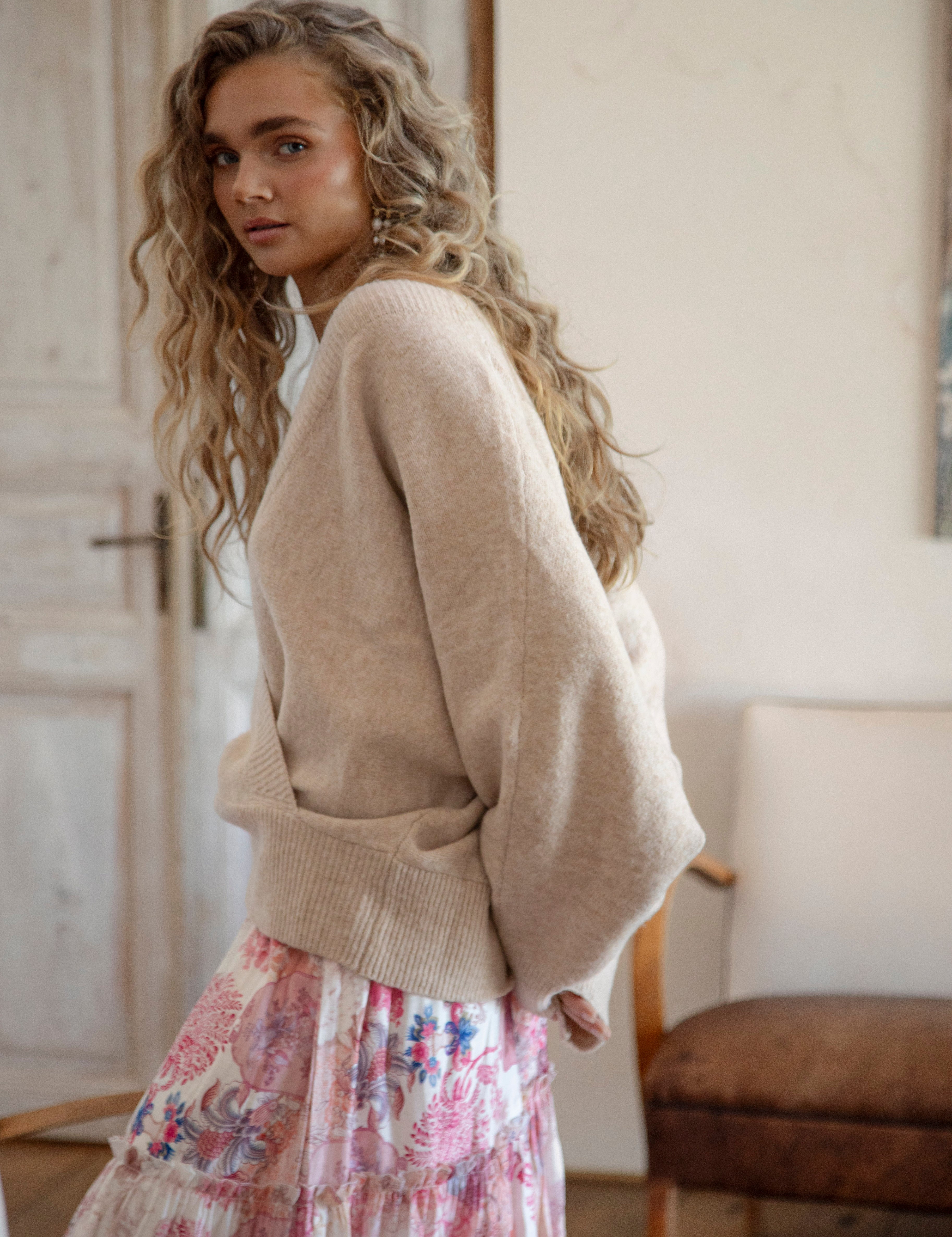 Belle Cross Over Knit showcasing crossover style and batwing sleeve