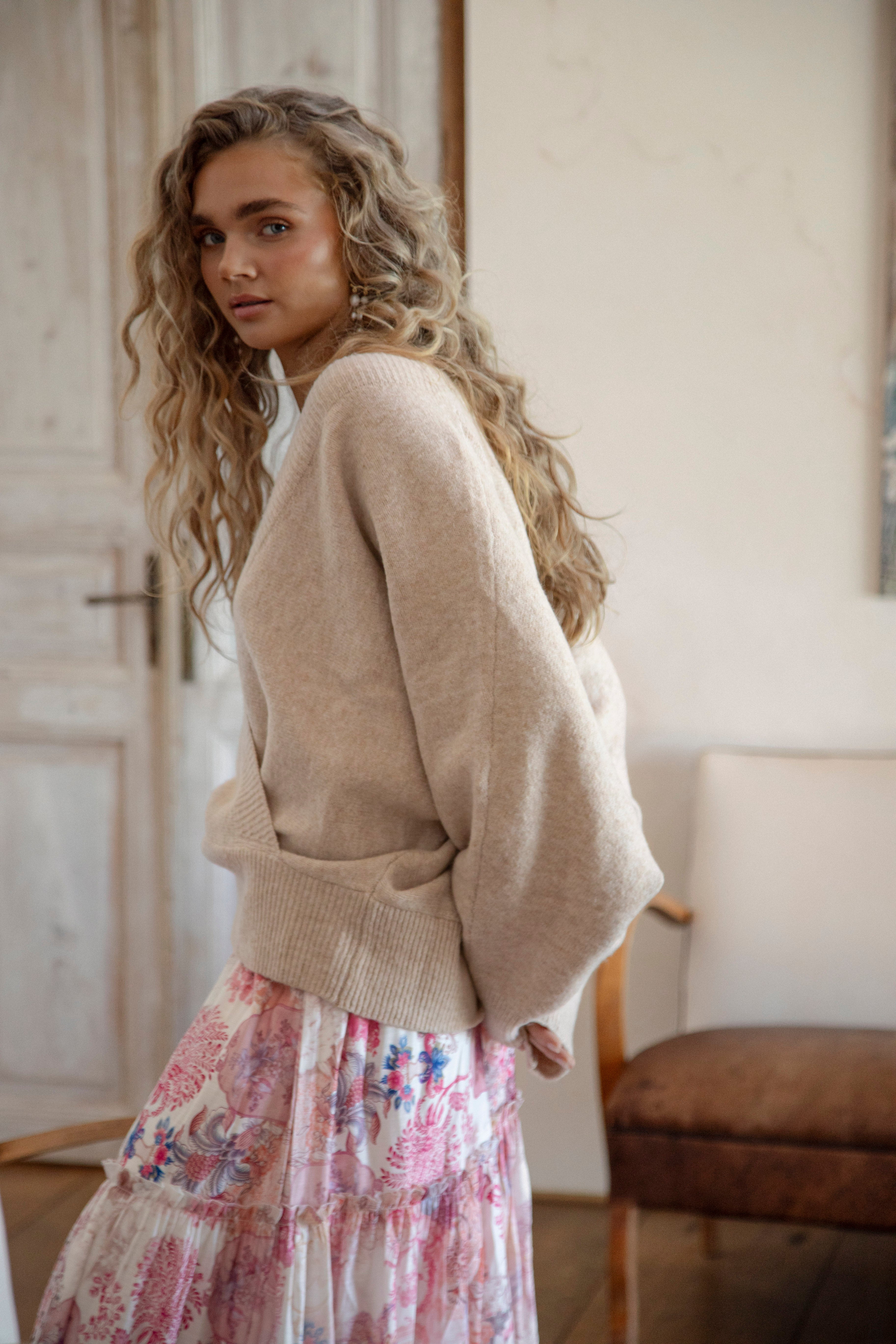 Belle Cross Over Knit showcasing crossover style and batwing sleeve