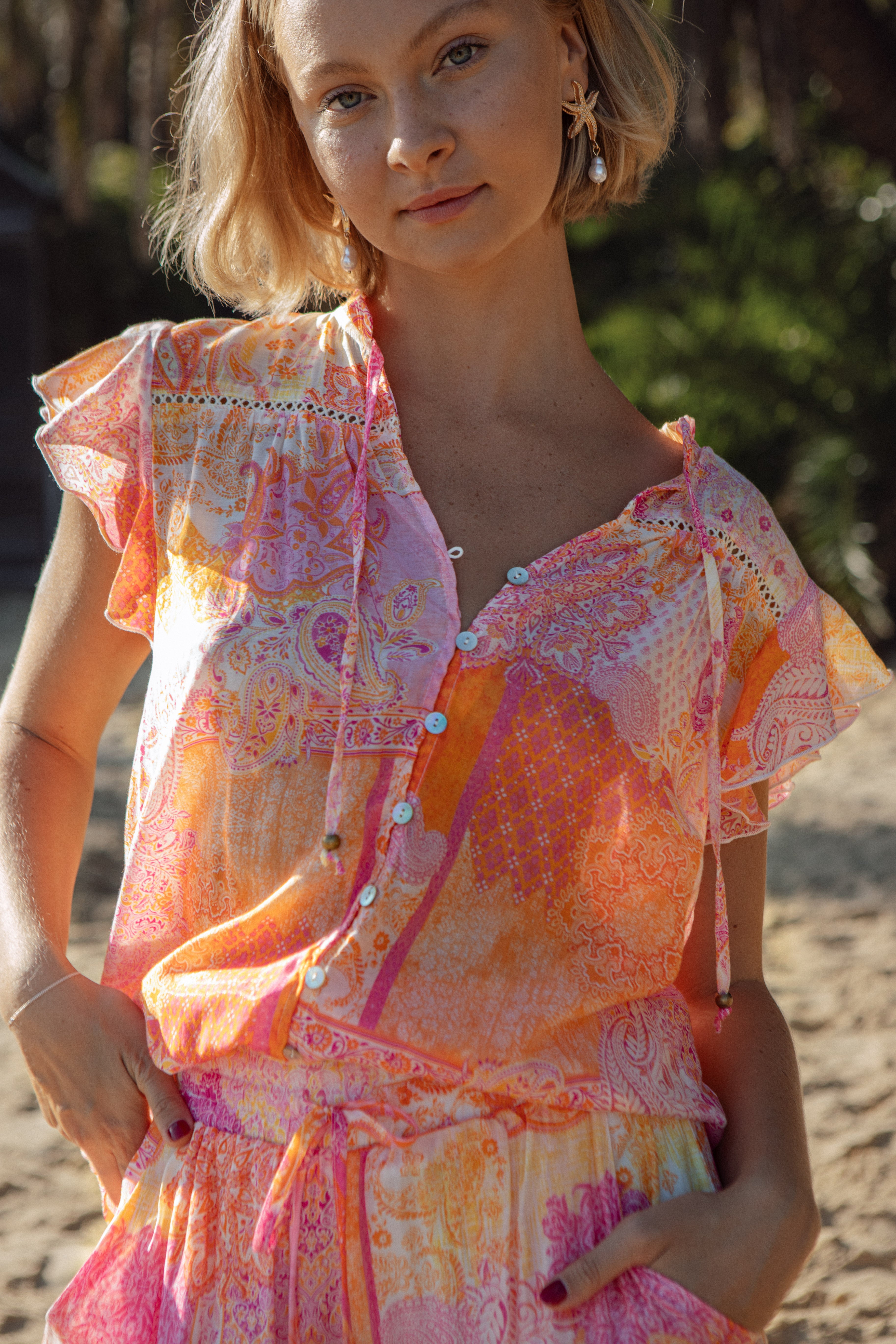 Blossom Blouse - Papaya featuring cap sleeves and button down detail