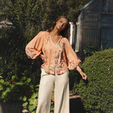 Bouquet Blouse featuring long billowy sleeves and floral print