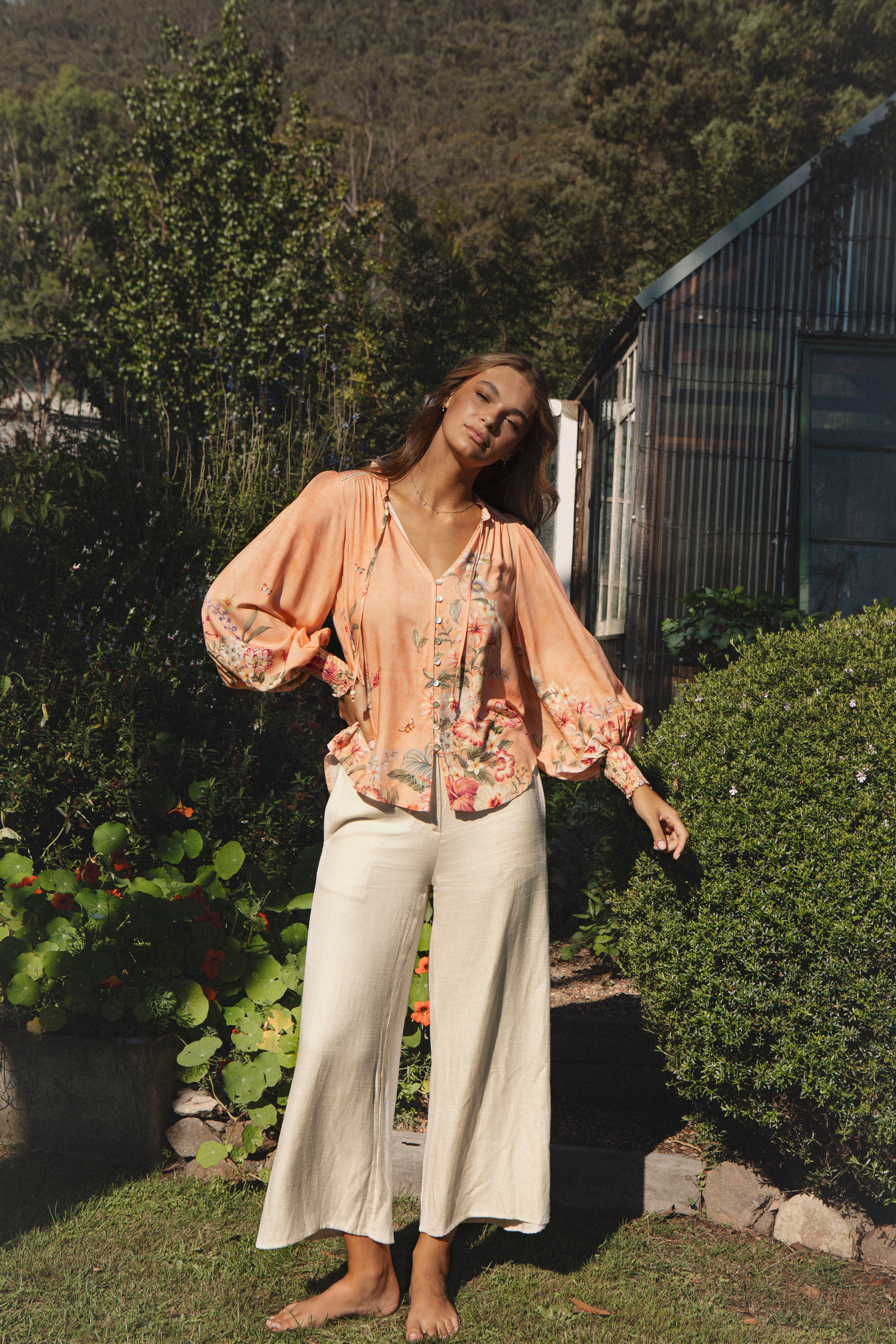 Bouquet Blouse featuring long billowy sleeves and floral print