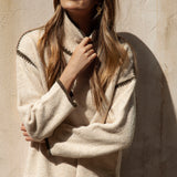 Byron Knit - Olive featuring neutral colourway and contrasting stitch at shoulder, neckline and cuff