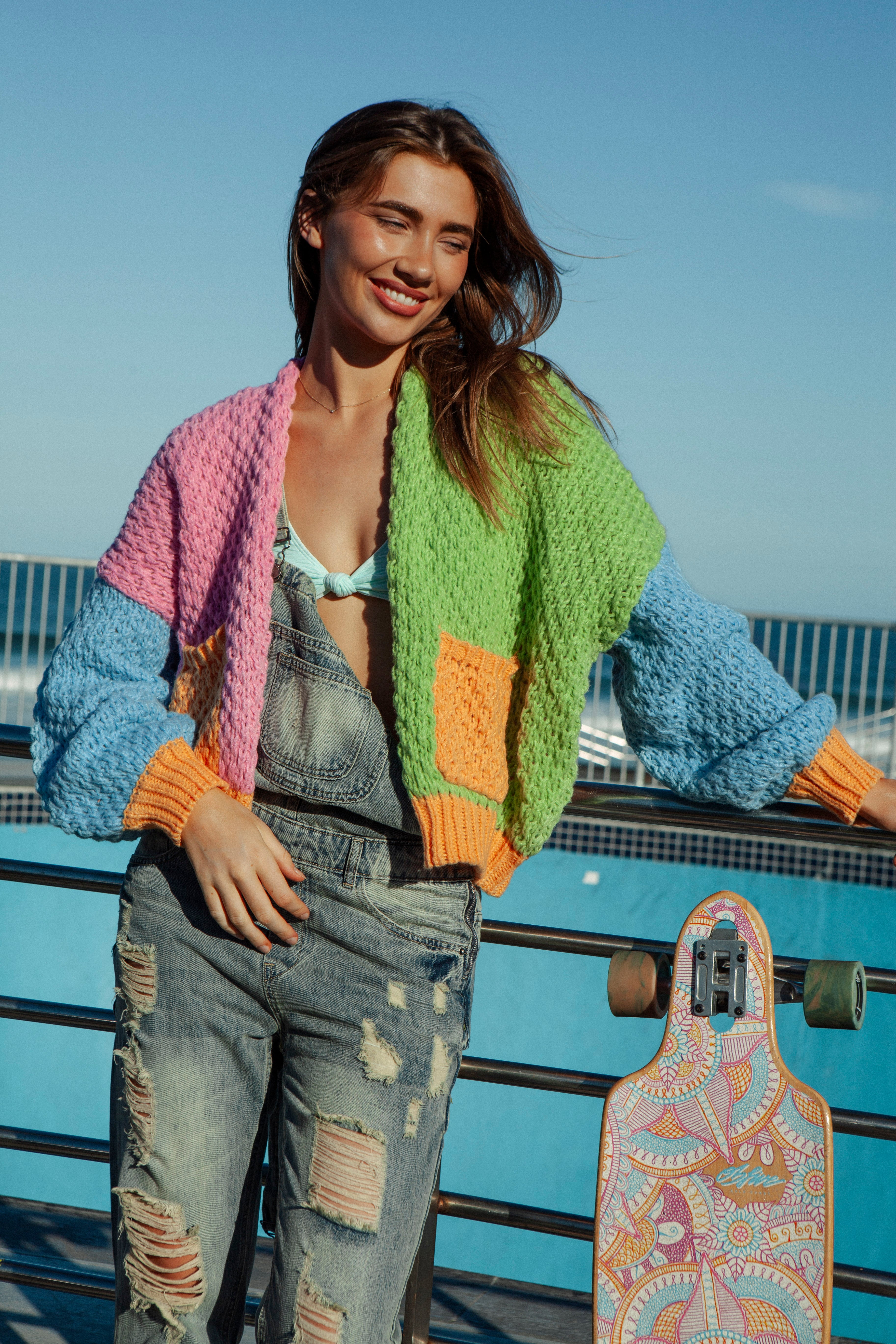Carnival Rainbow Cardi. Block colour cardigan in shades of pink, green, blue and orange.