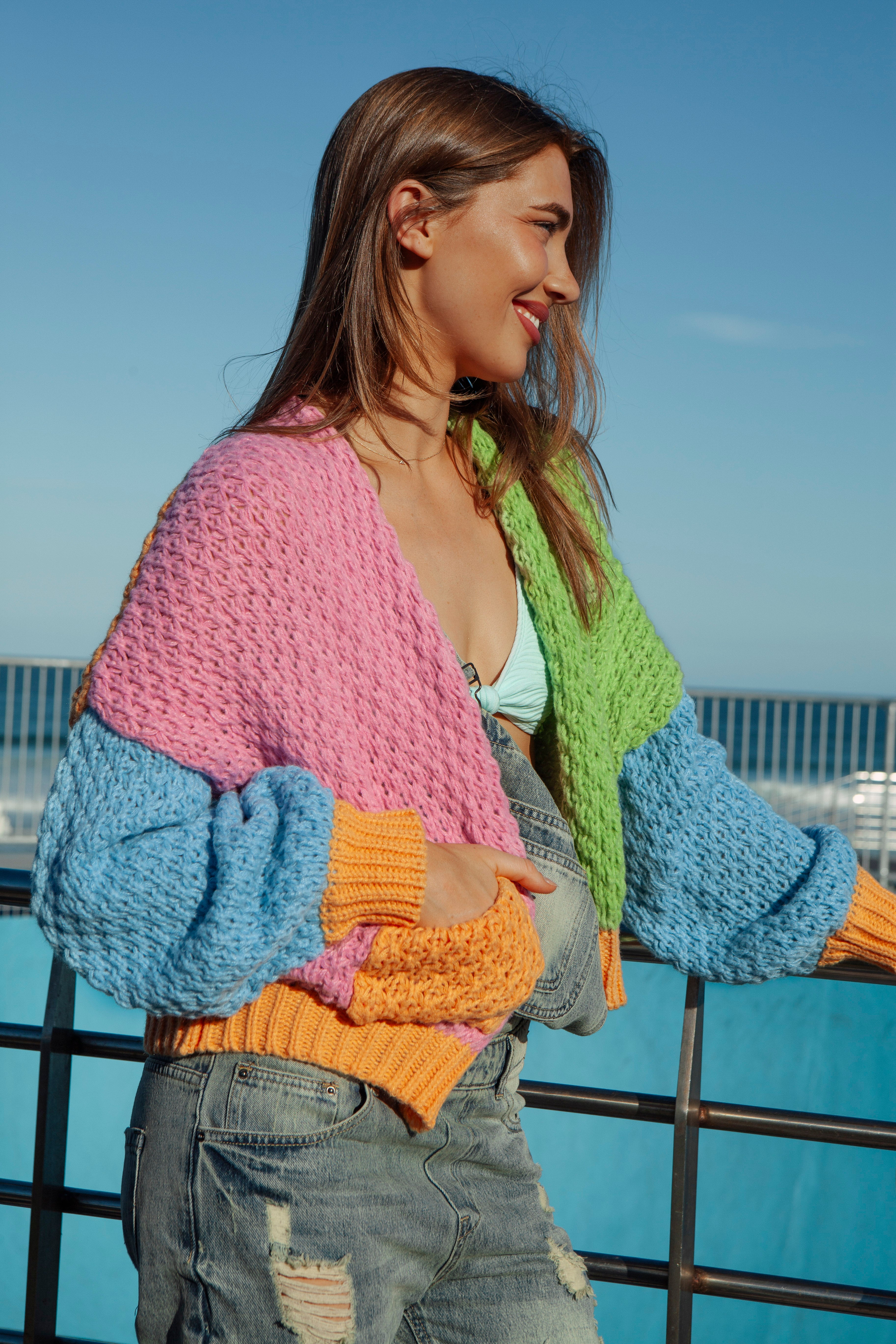 Carnival Rainbow Cardigan showcasing statement pockets and textured knit.