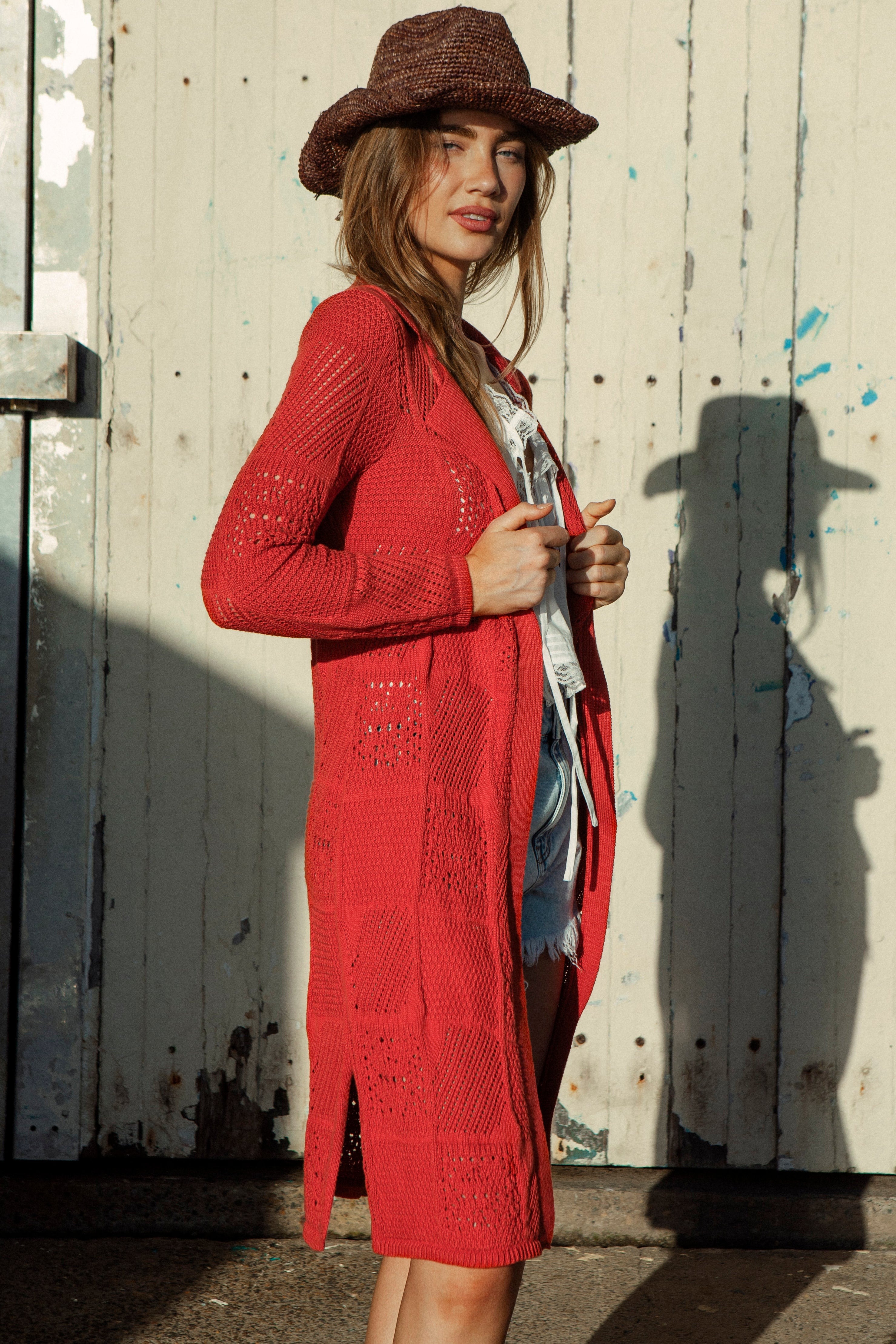 Cinder A-line Cardigan Rust featuring side split and crochet style knit