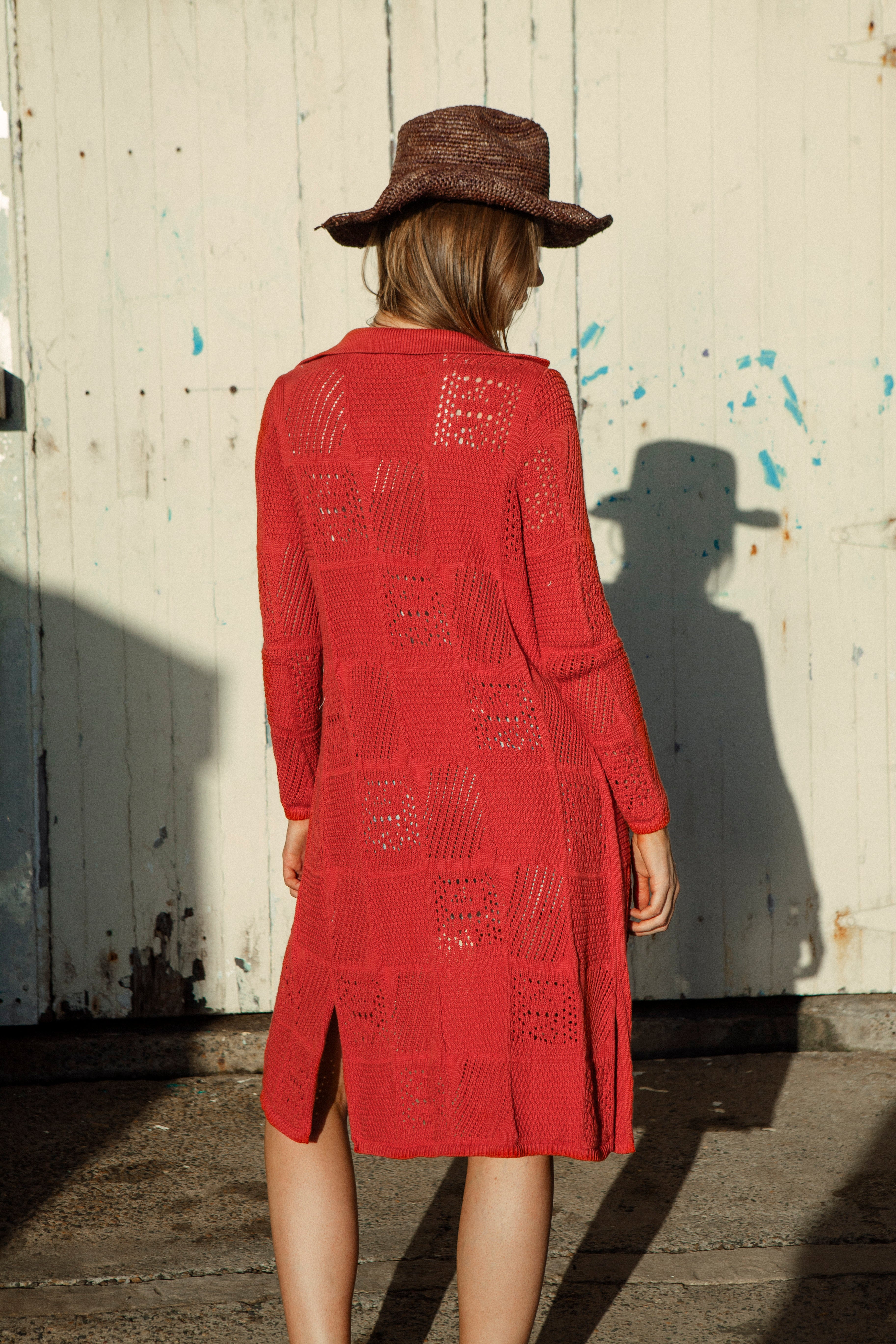 Cinder A-line Cardigan Rust. Rear view showcasing loose style knit and burnt orange colourway.