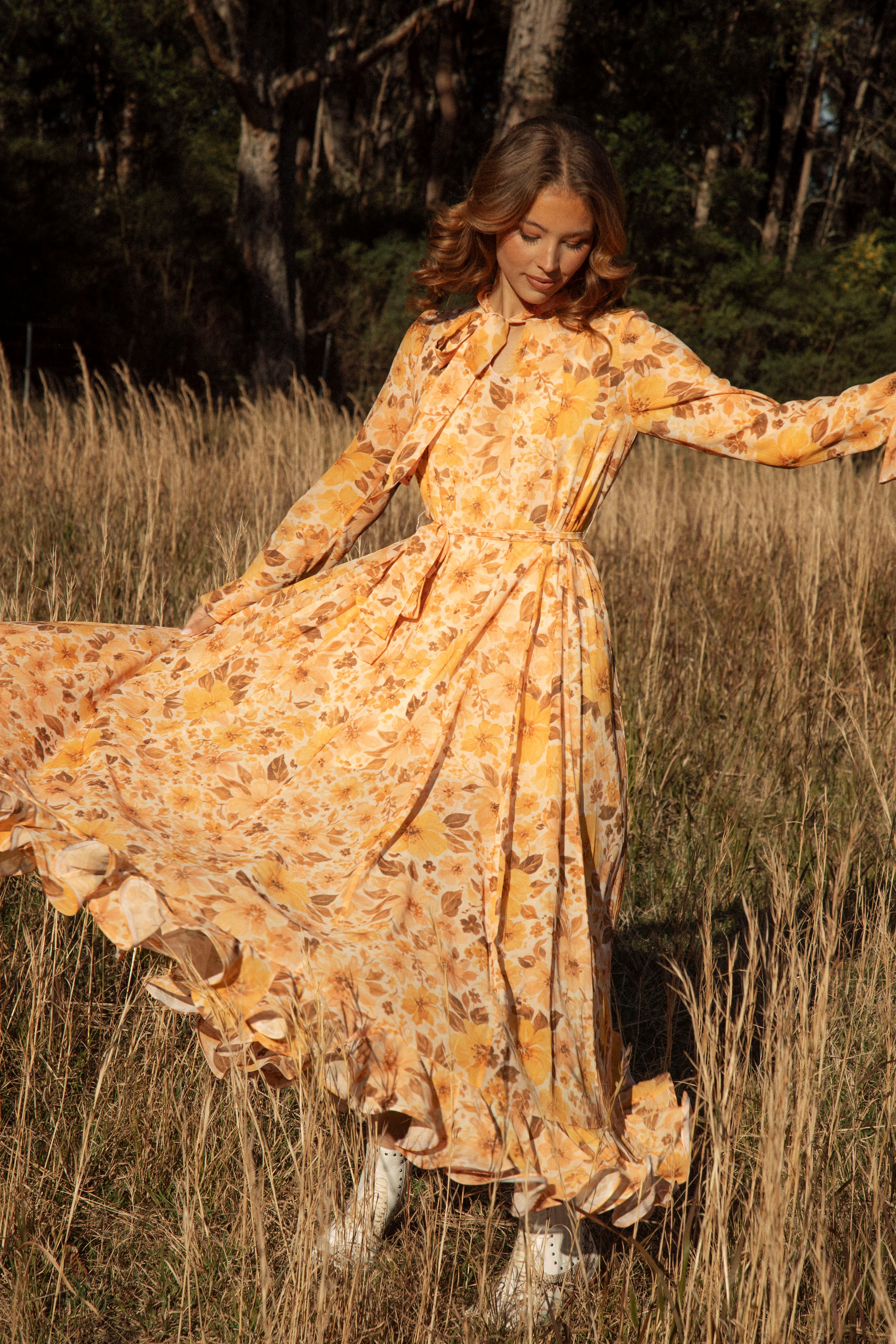 Clementine Maxi Dress featuring a vintage-inspired floral pattern in shades of orange and brown