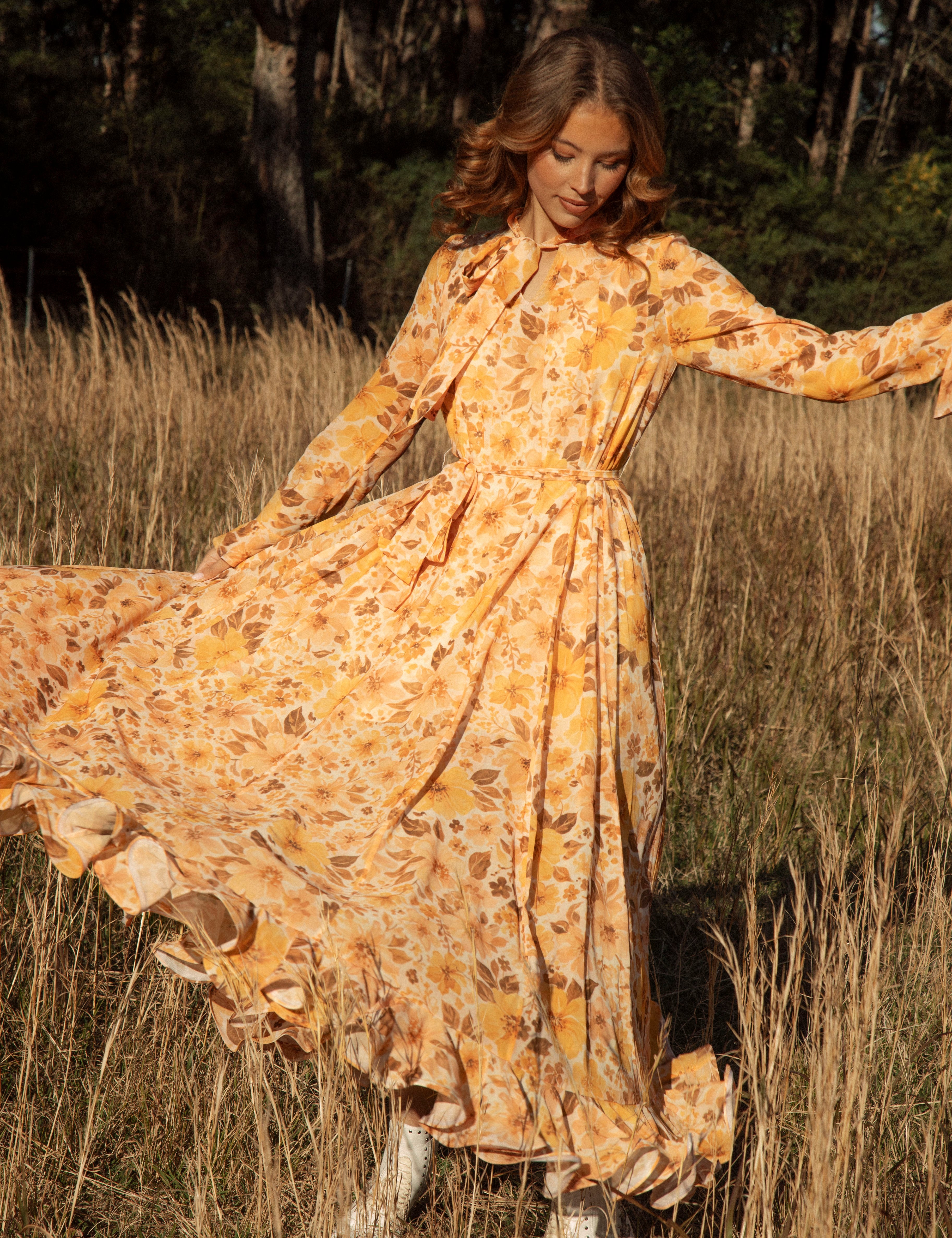 Clementine Maxi Dress featuring a vintage-inspired floral pattern in shades of orange and brown
