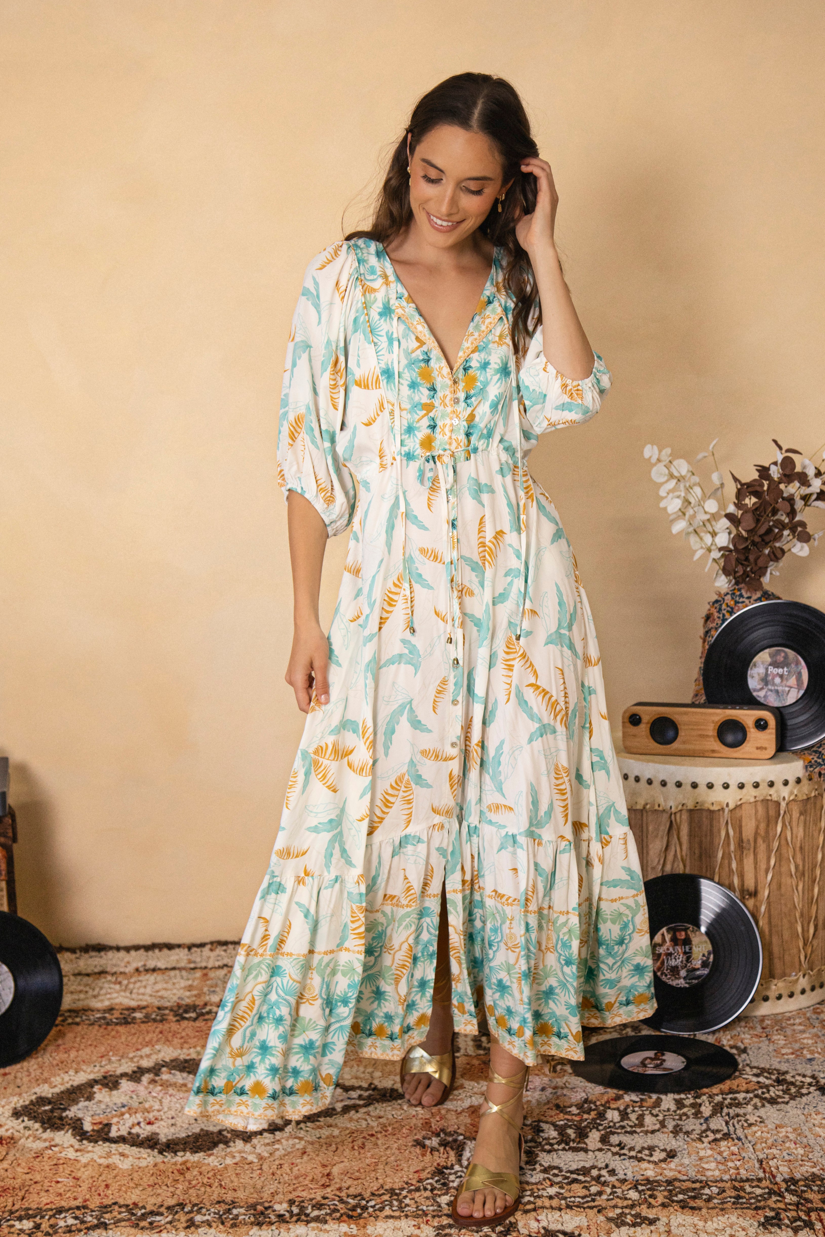 Cleo Maxi Dress Island Breeze is a Boho style maxi dress in white with aqua and beige tropical inspired pattern with contrasting trim at hem and bodice