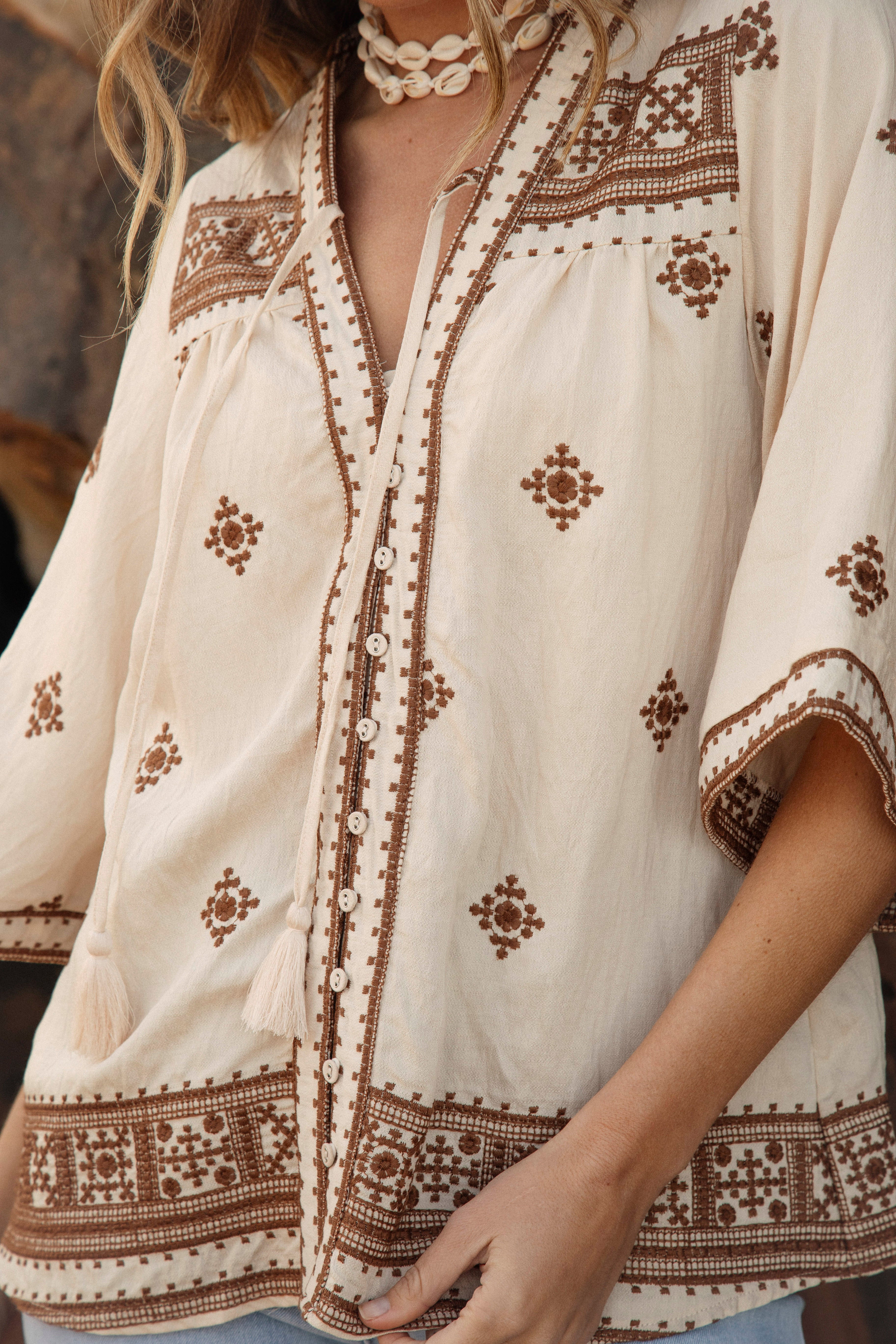 Coco Blouse - close up view of embroidered Boho style pattern in brown stitching
