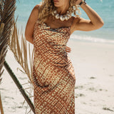 Coco Slip Dress featuring spaghetti straps, cowl neckline and geometric batik pattern in shades of rust and cream