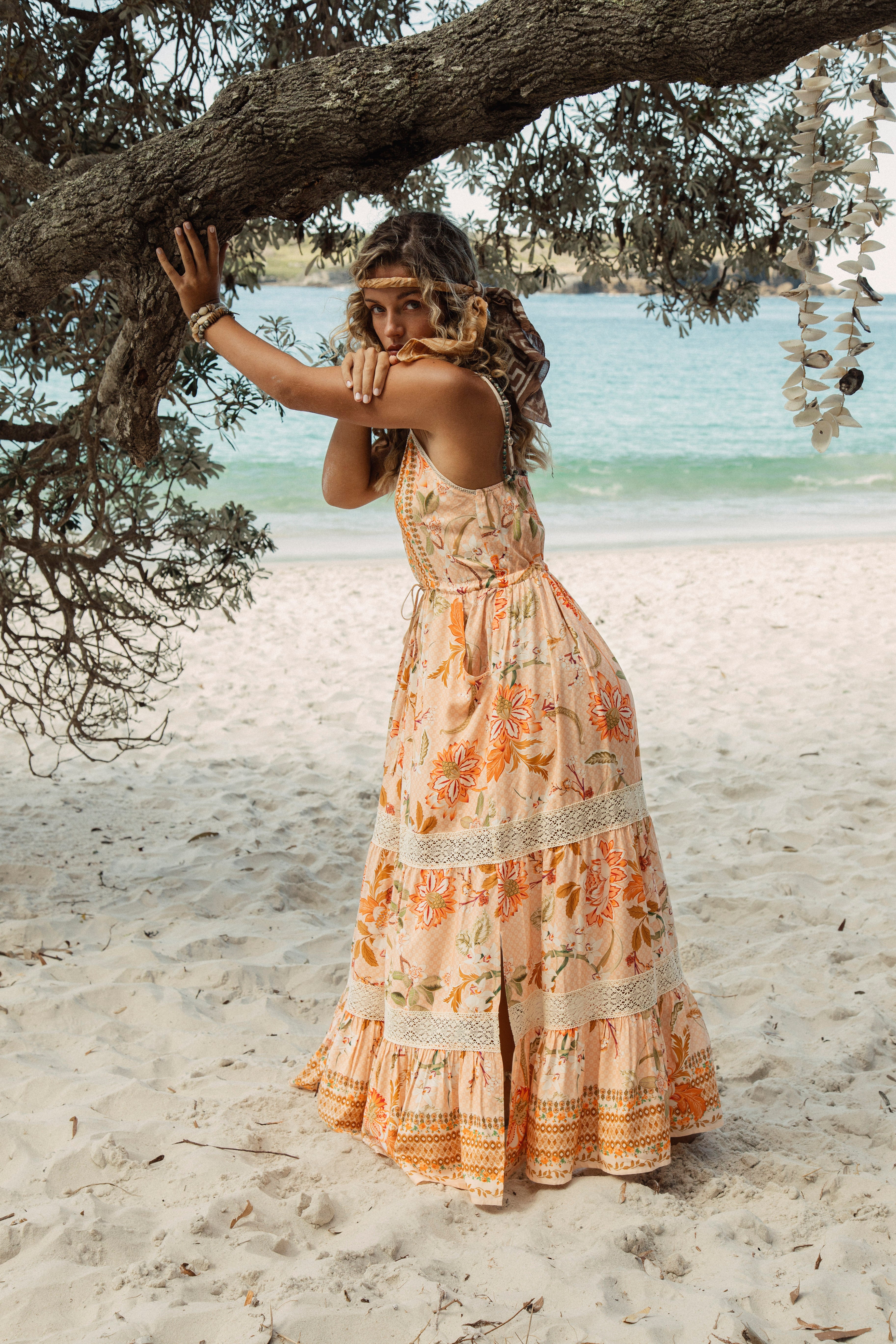 Coral Sands Sundress is a Boho style maxi length dress featuring side pockets and tiered skirt