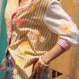 Cosmo Shirt Sandy - bold beige and white stripes on body, white sleeves and contrasting gingham trim in shades of green, pink, blue and white.
