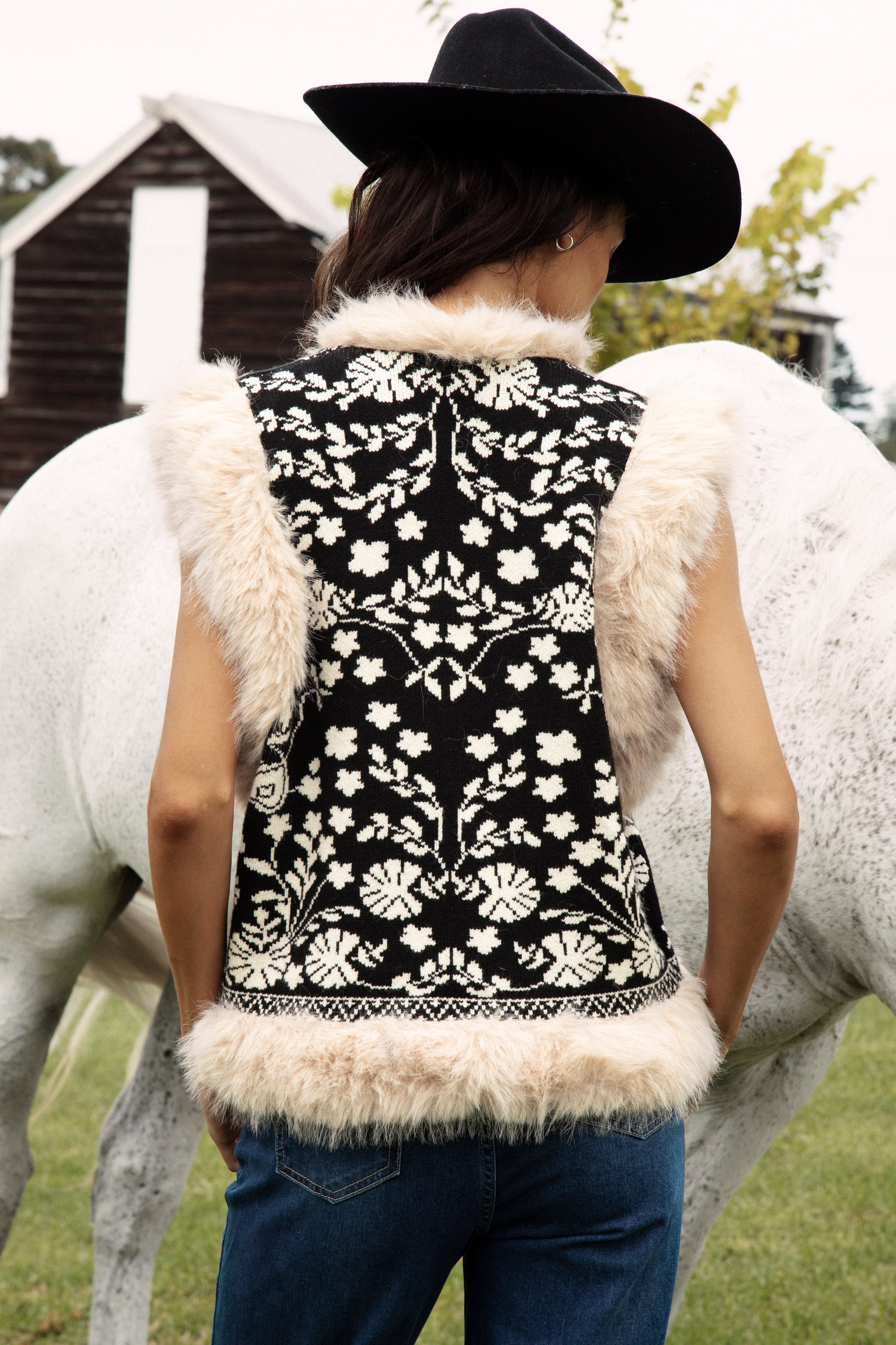 Cowgirl Vest Black - rear view showcasing vintage inspired floral pattern in cream
