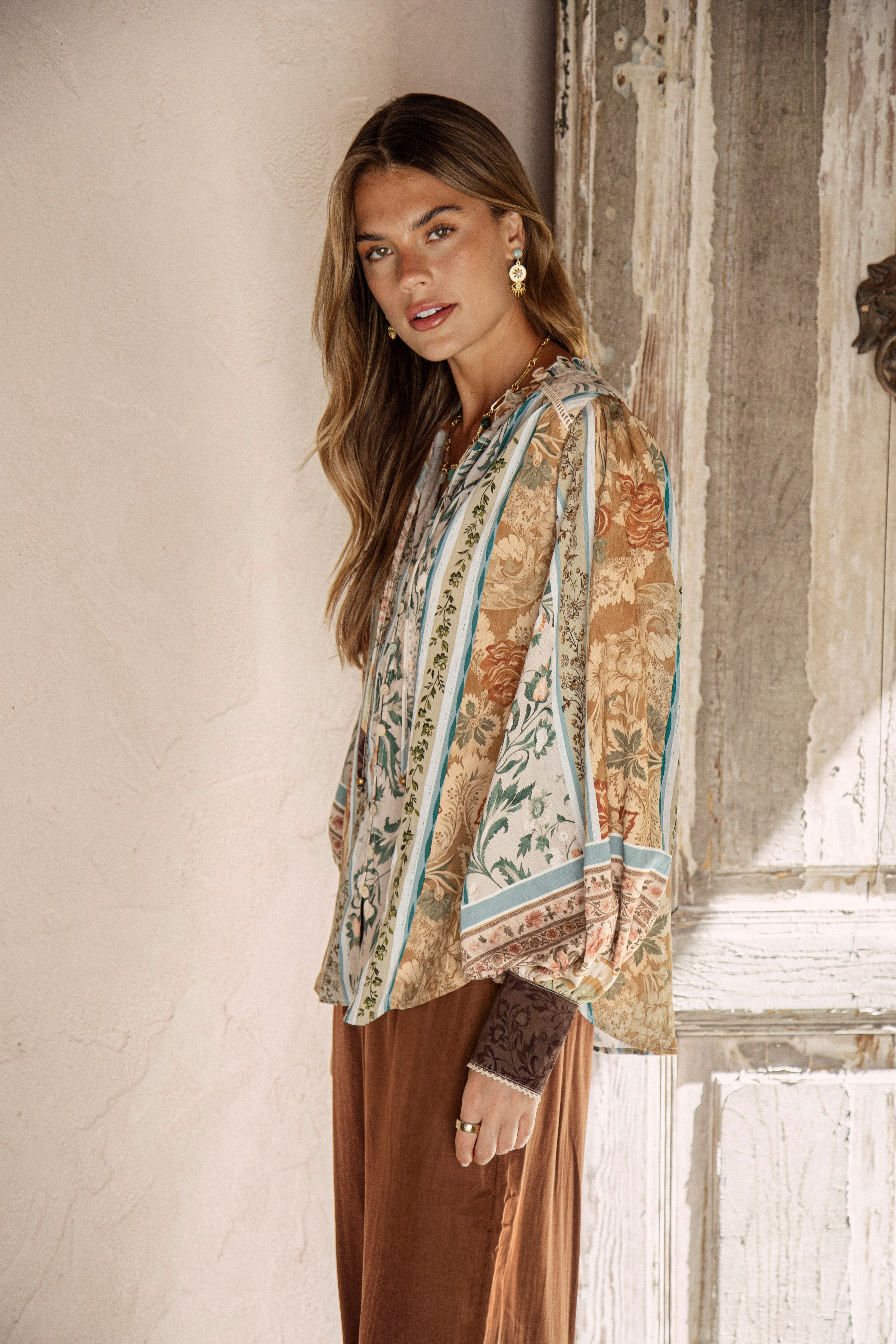 Daphne Blouse Olive - side view showcasing billowy sleeves and vintage inspired boho print