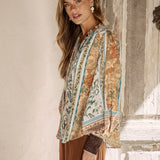 Daphne Blouse Olive - side view showcasing billowy sleeves and vintage inspired boho print
