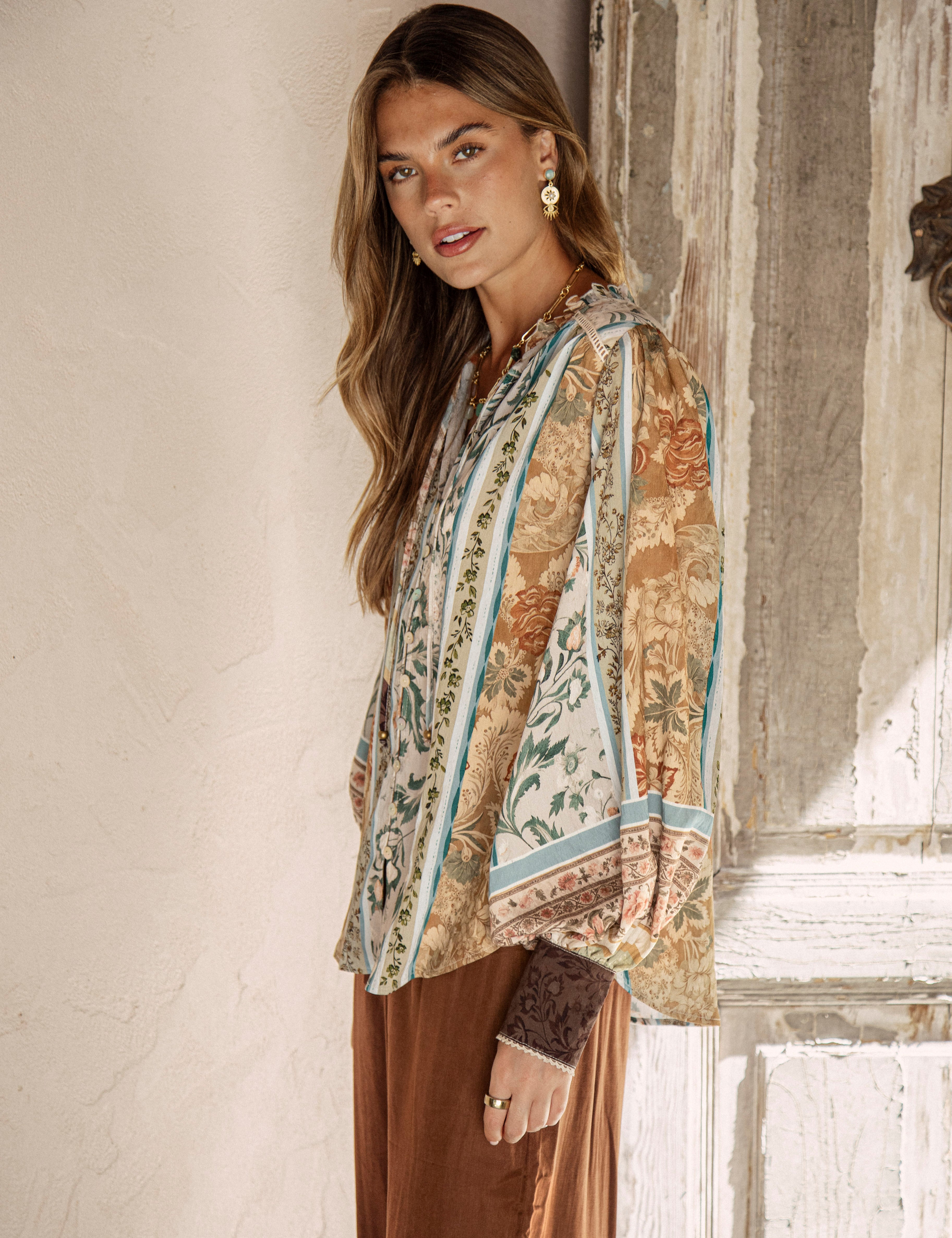Daphne Blouse Olive - side view showcasing billowy sleeves and vintage inspired boho print