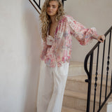 Daphne Blouse Posie featuring long billowy sleeves, button down style and delicate floral pattern in shades of pink