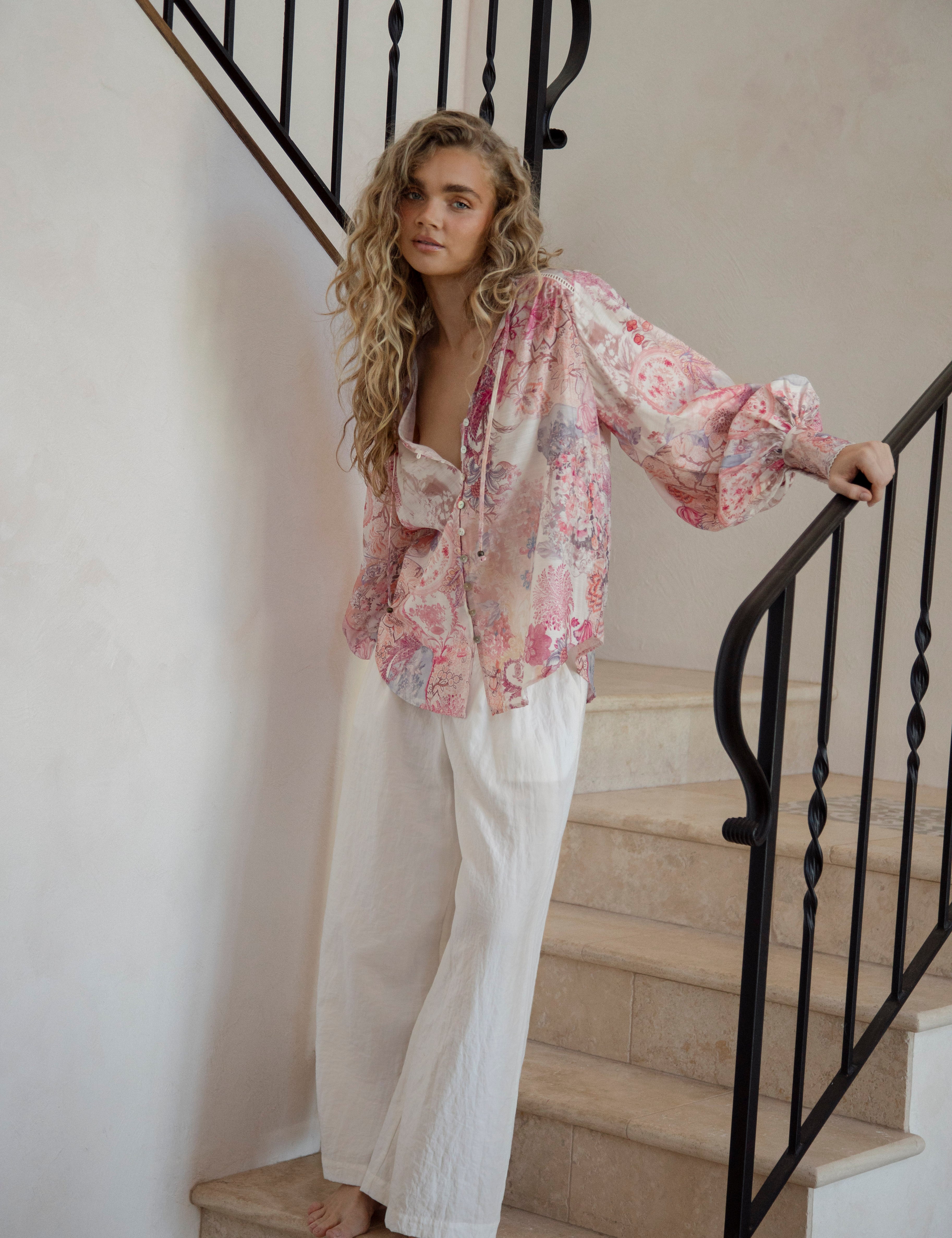 Daphne Blouse Posie featuring long billowy sleeves, button down style and delicate floral pattern in shades of pink