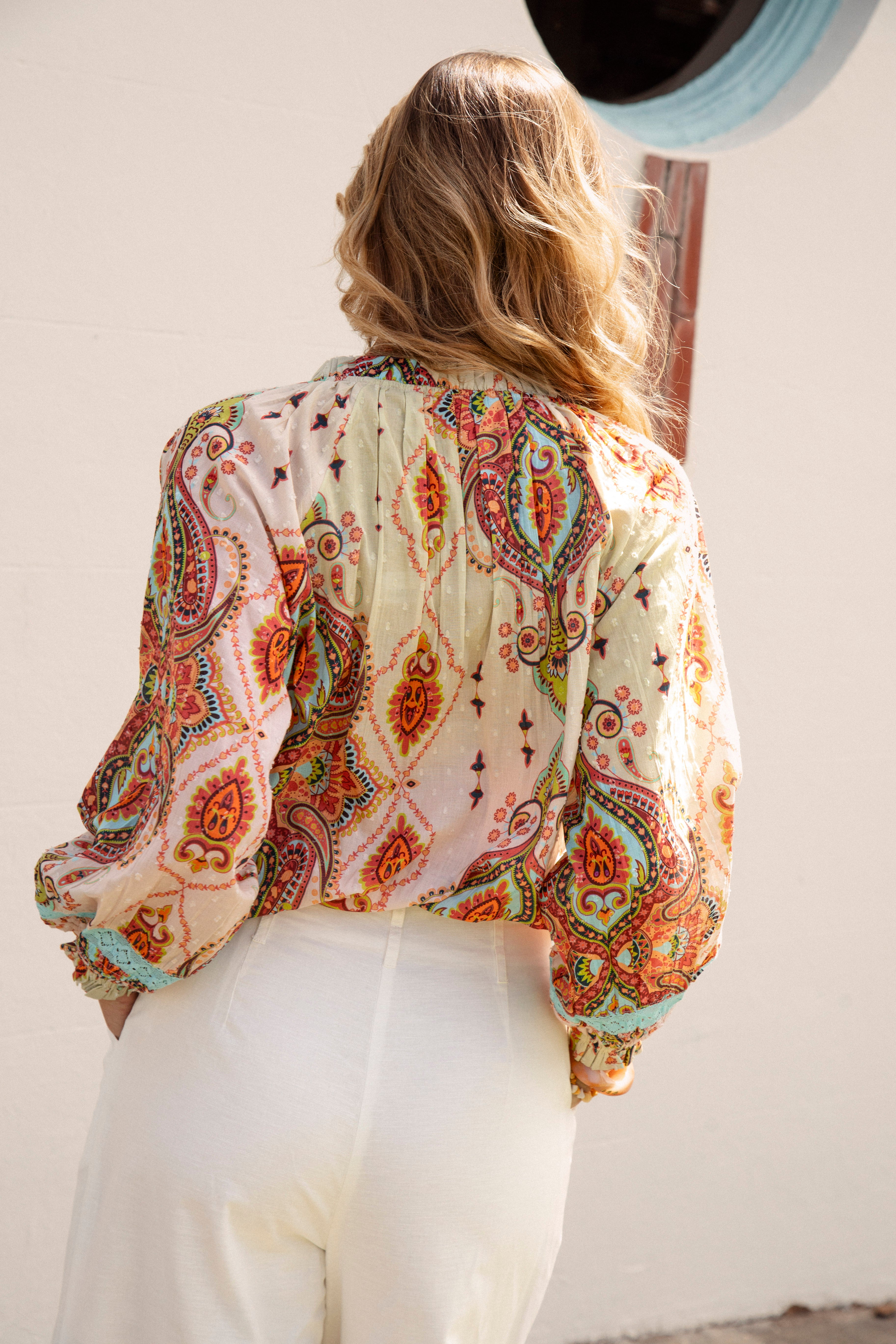 Delfi Blouse Rio - rear view showcasing pin tuck details and boho-inspired paisley print
