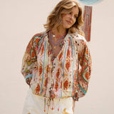 Delfi Blouse Rio features button down style and tie drawstring at waist