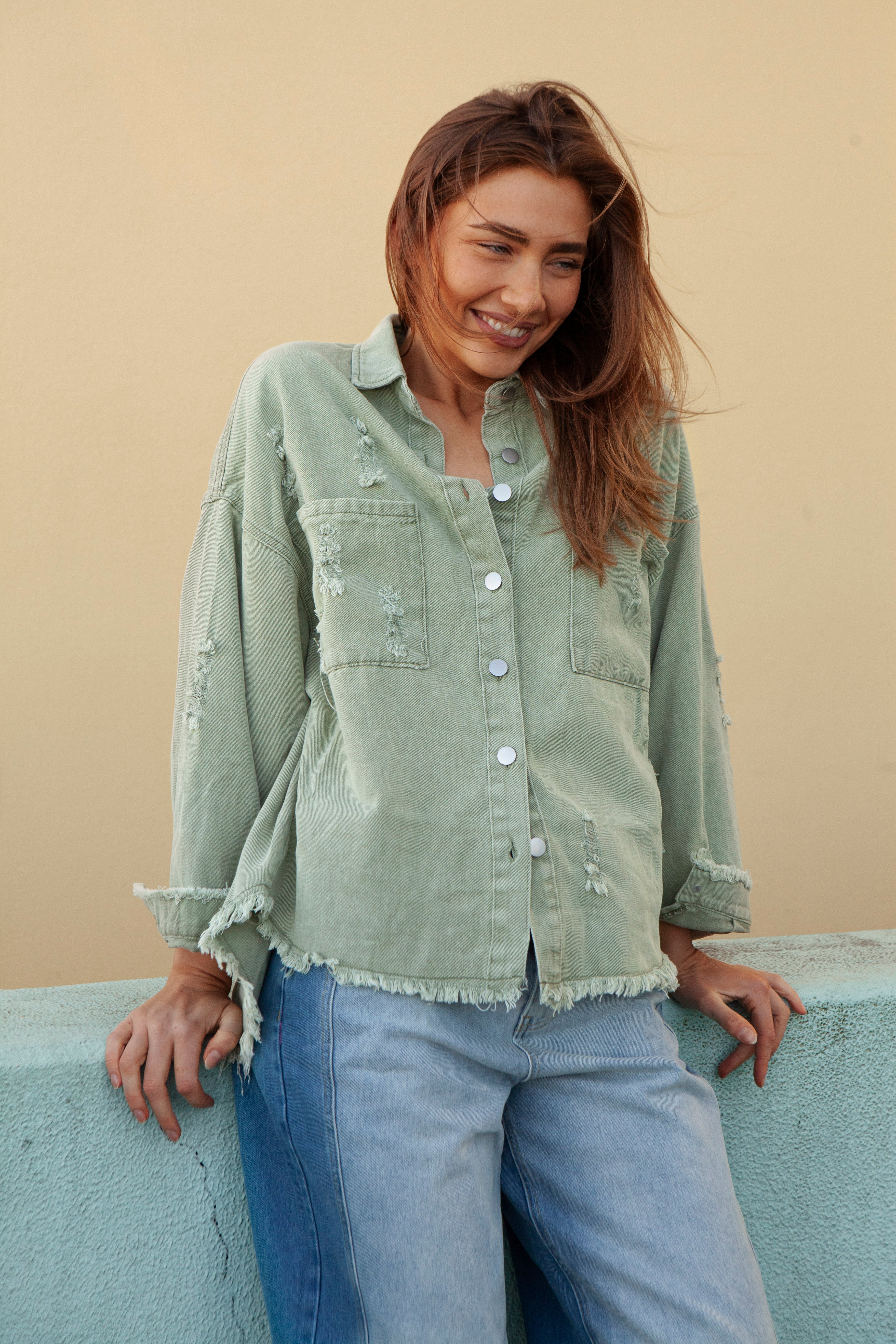 Desert Jacket Cactus - green denim jacket with frayed hem and distressed details.