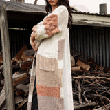 Dusk Horizon Cardigan. Side view showcasing billowy sleeves in chunky knit.