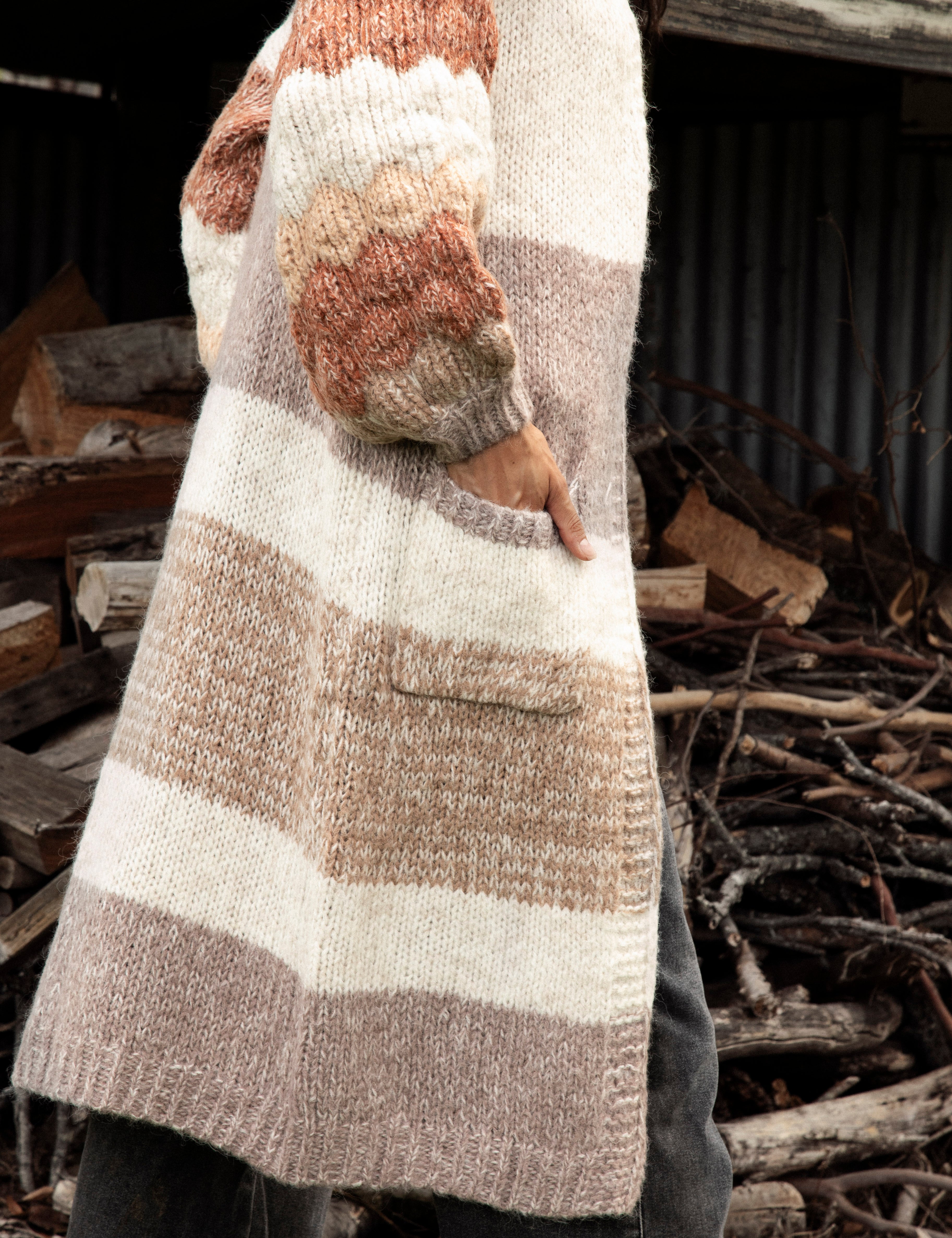 Dusk Horizon Cardigan showcasing pockets, longline length and chunky knit sleeves.