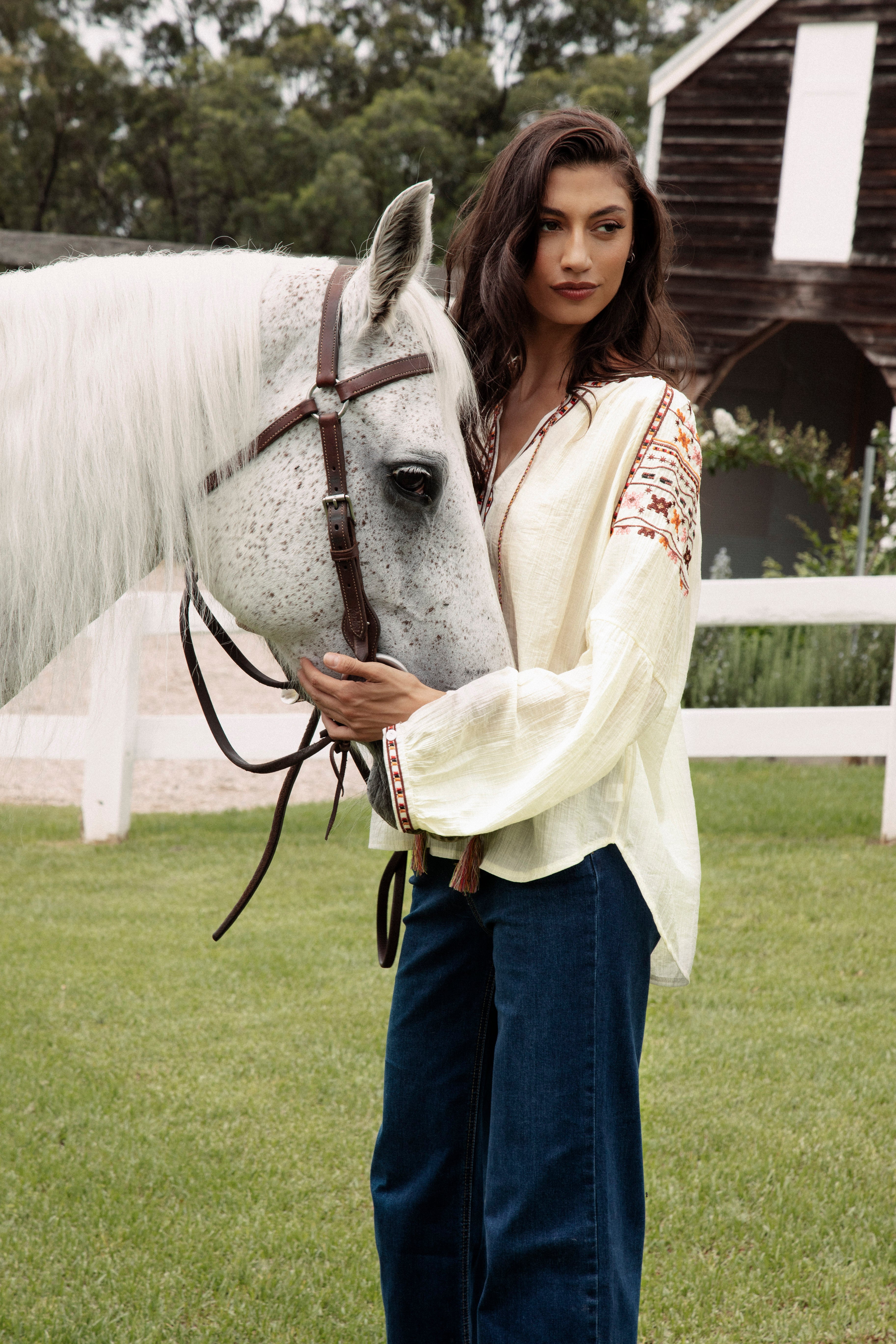 Eve Embroidered Blouse featuring delicate embroidery at cuffs, sleeves and neckline.