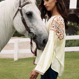 Eve Embroidered Blouse Side View showcasing floral embroidery in Autumnal tones on sleeve.