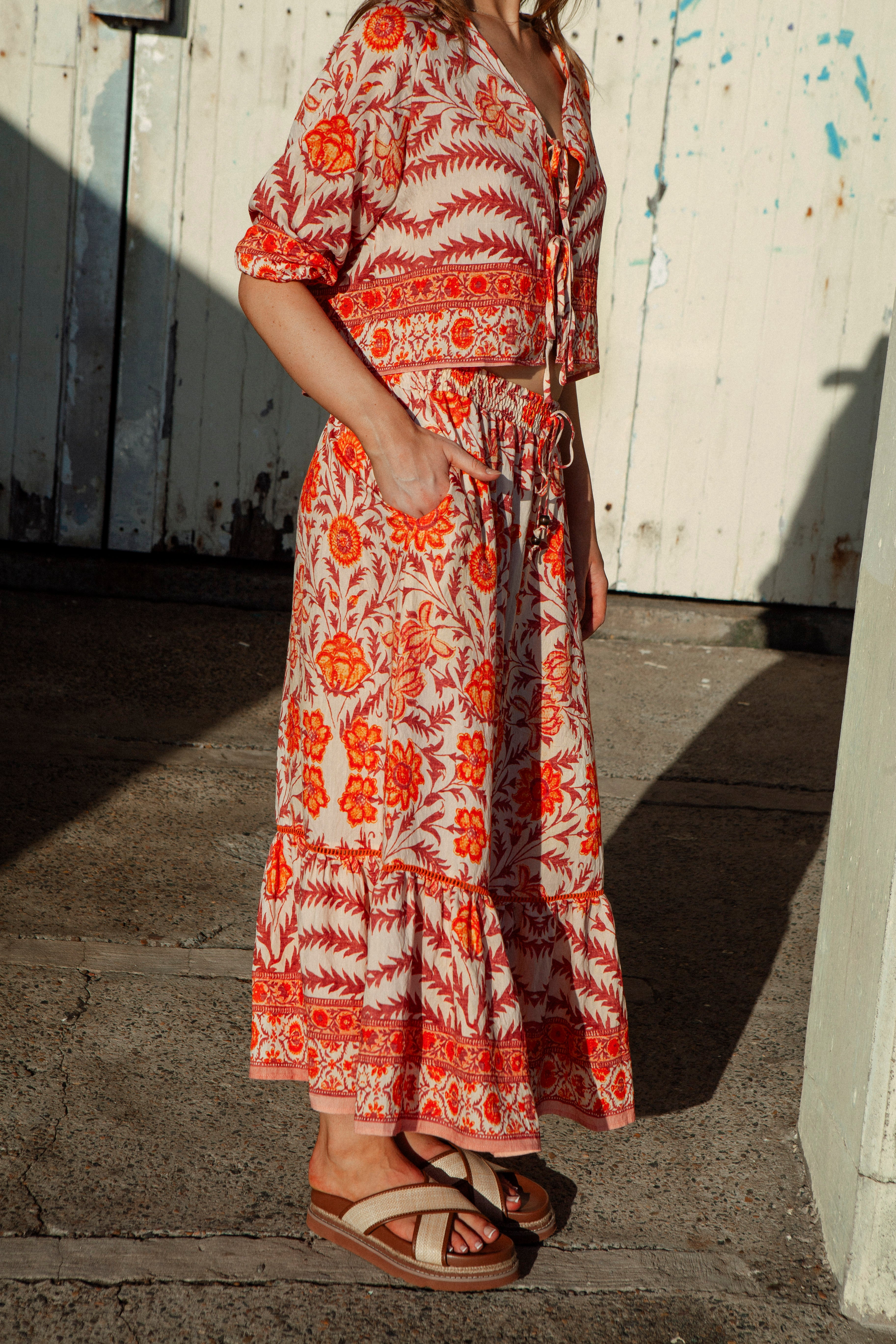 Evelyn Skirt Marigold showcasing Bohemian maxi skirt style and side pockets.