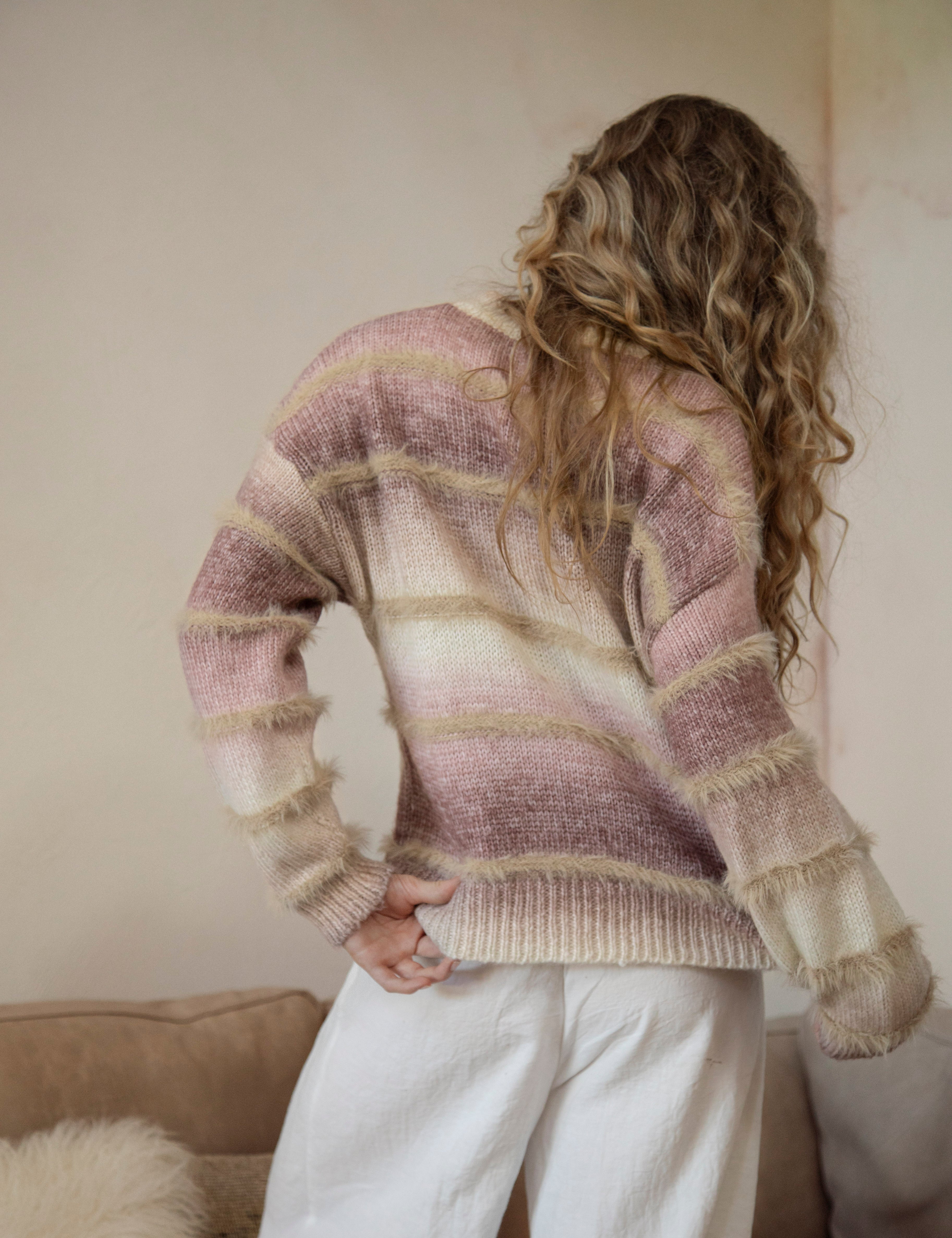 Fawna Sweater - rear view showcasing striped pattern and frayed detail.