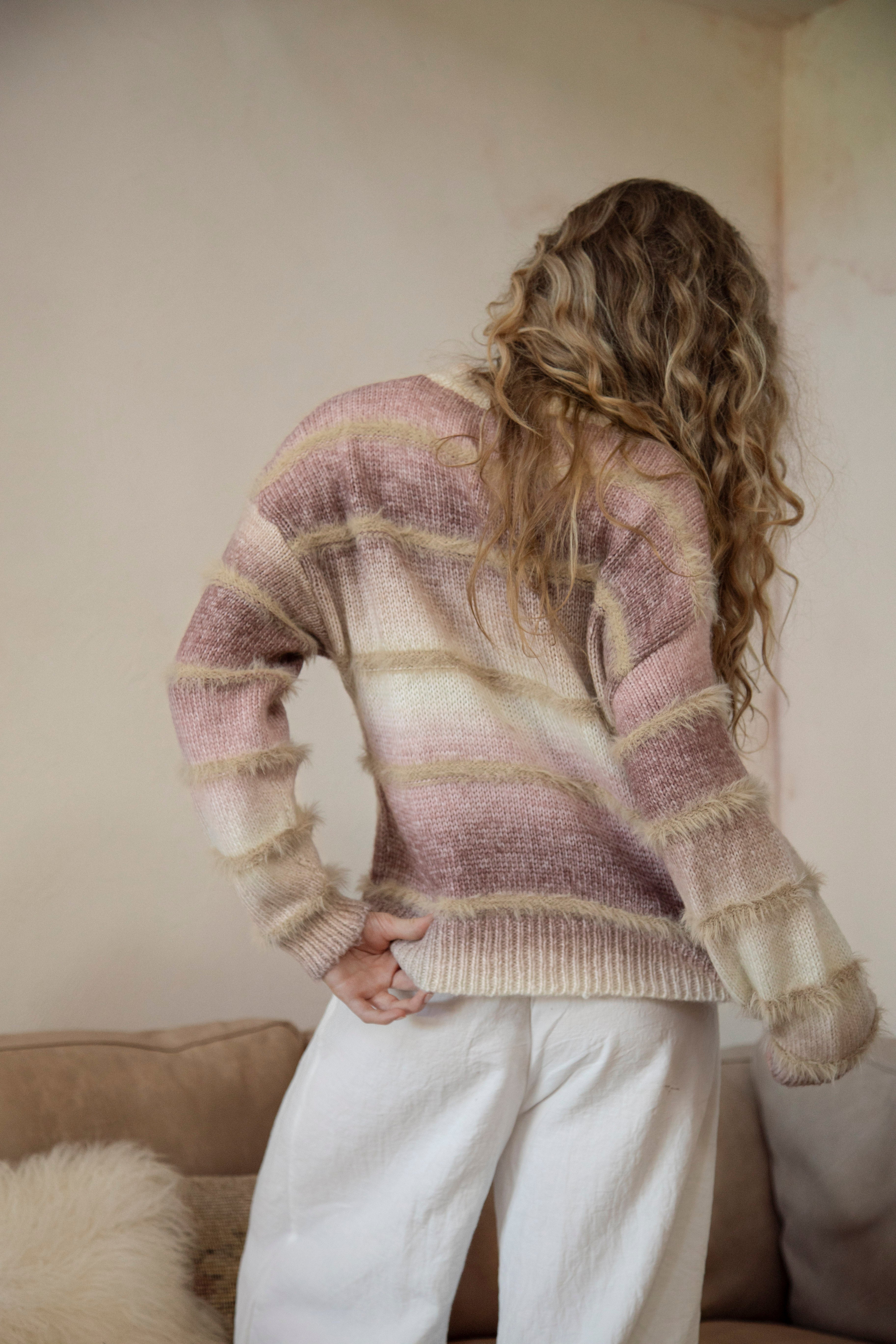 Fawna Sweater - rear view showcasing striped pattern and frayed detail.