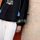 Flower Power Embroidered Long Sleeve Top Black showcasing floral embroidery at bodice and cuff
