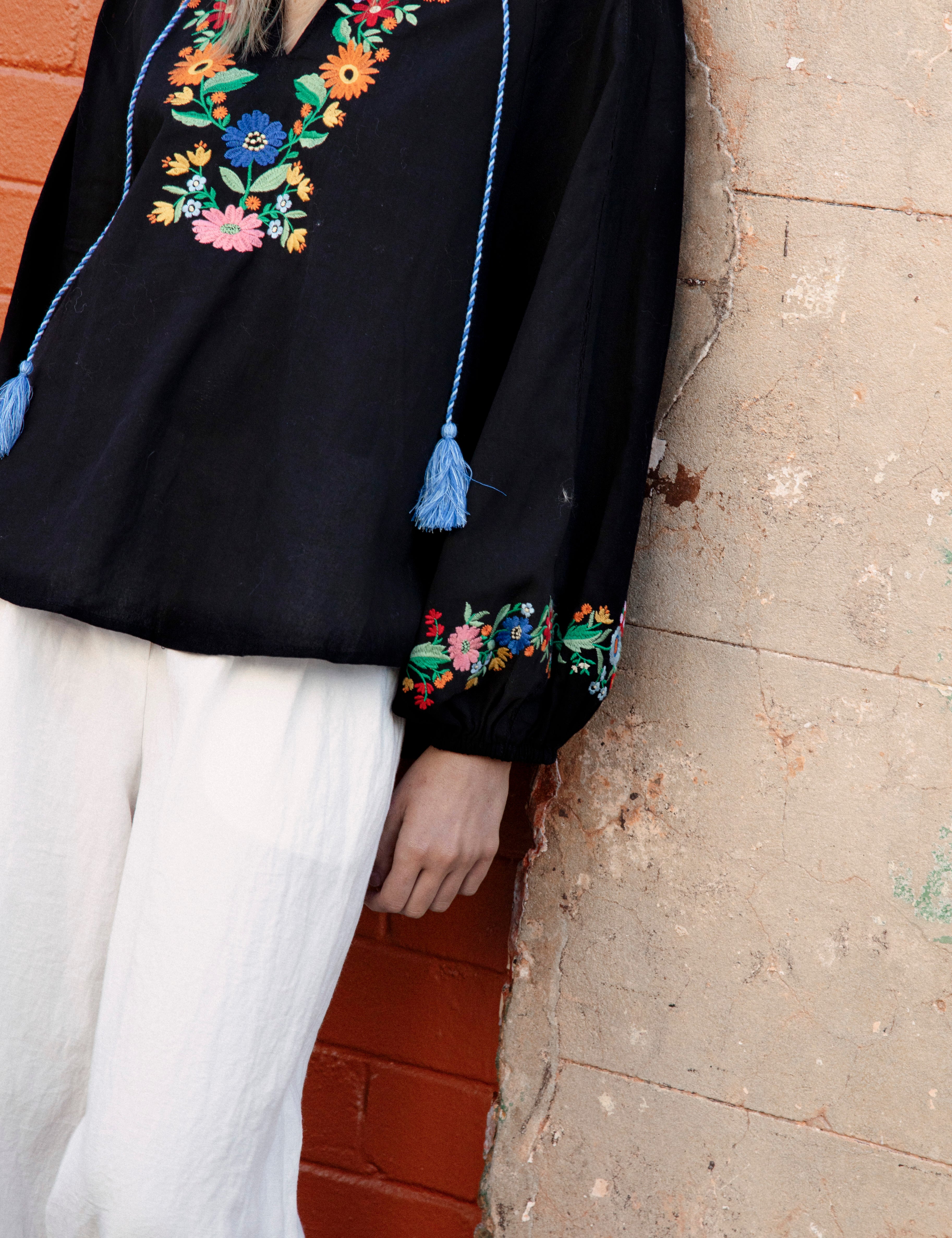 Flower Power Embroidered Long Sleeve Top Black showcasing floral embroidery at bodice and cuff
