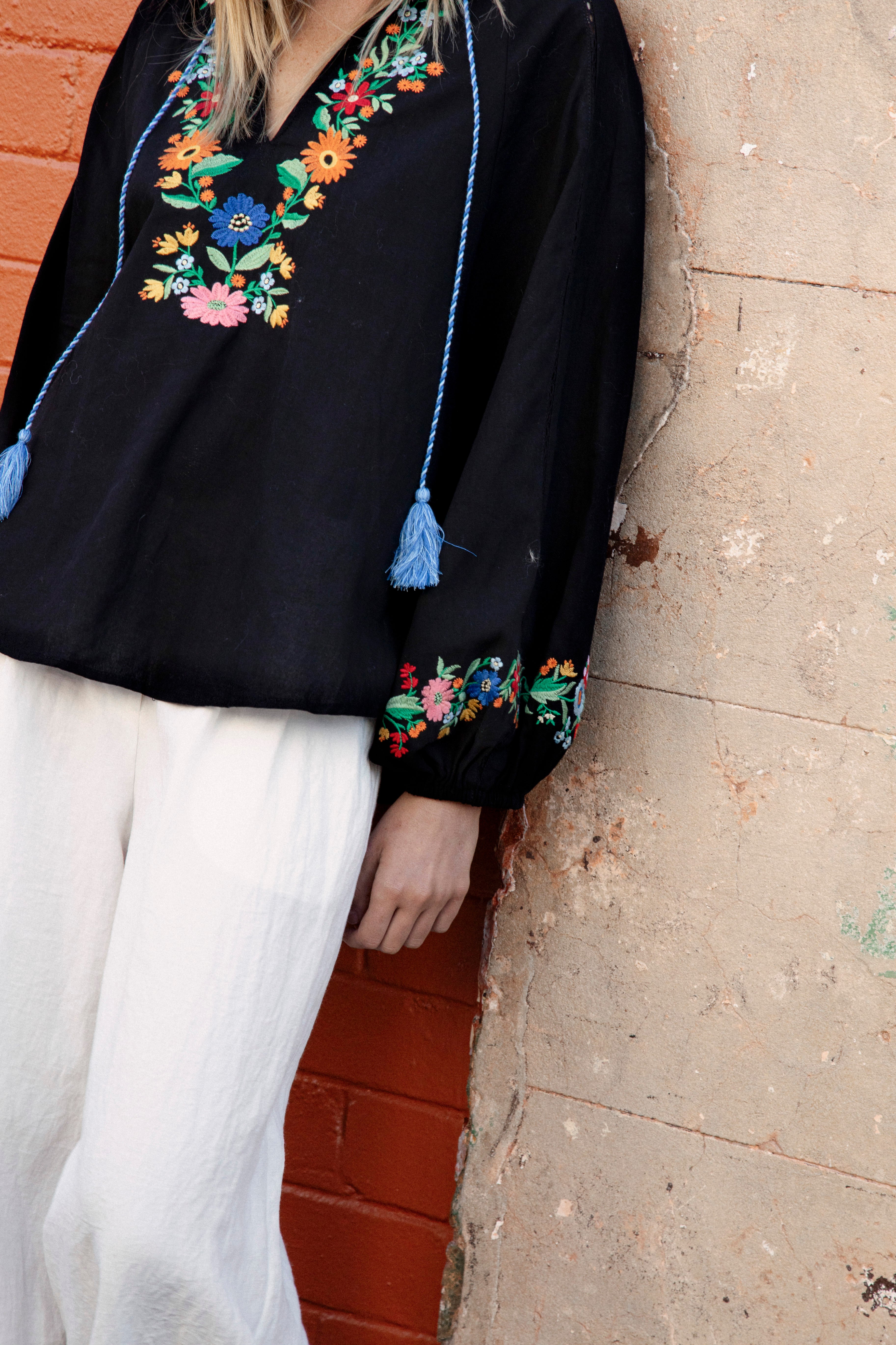 Flower Power Embroidered Long Sleeve Top Black showcasing floral embroidery at bodice and cuff