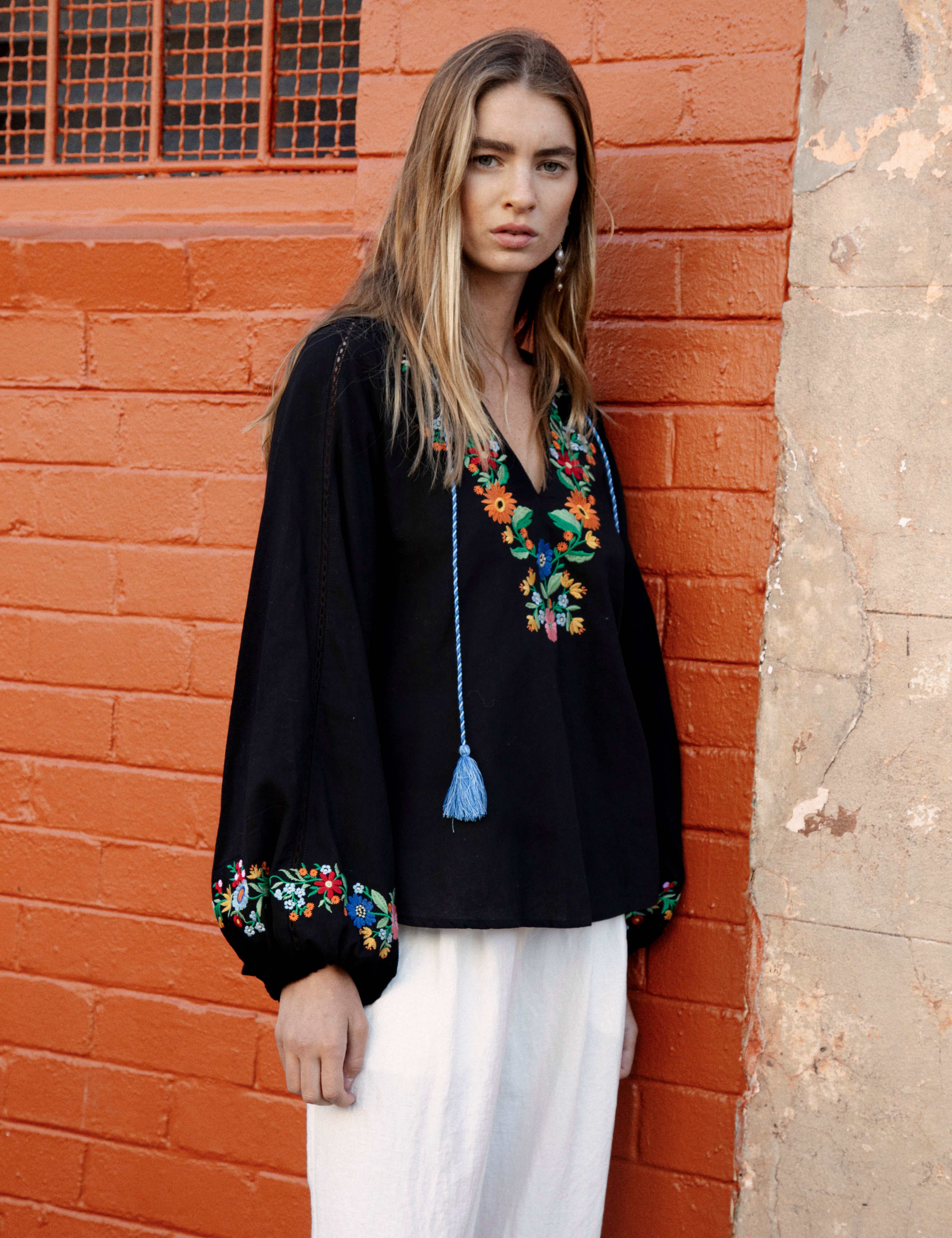 Flower Power Embroidered long sleeve top in black colurway with bright floral embroidery at bodice and cuff