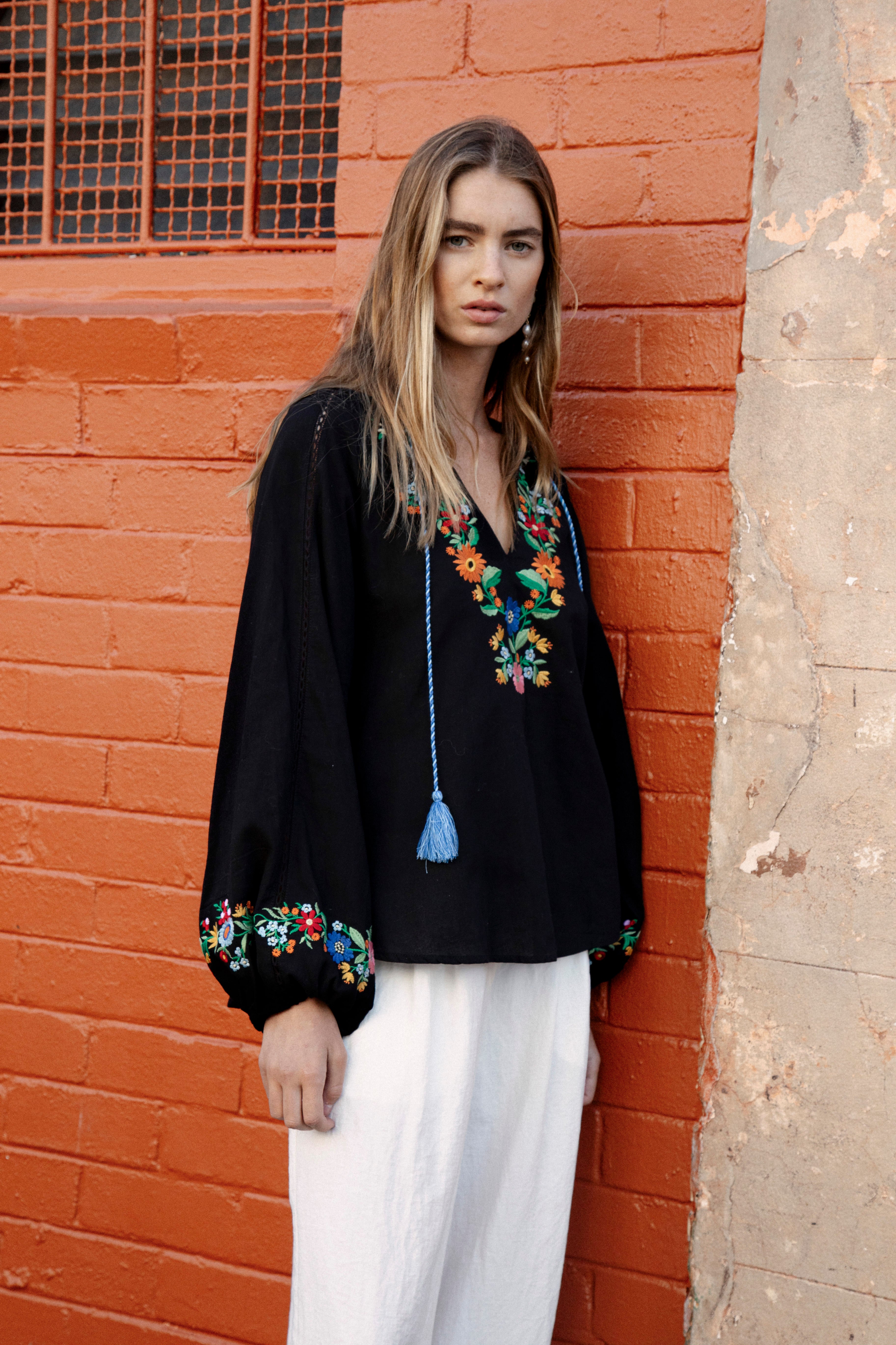 Flower Power Embroidered long sleeve top in black colurway with bright floral embroidery at bodice and cuff
