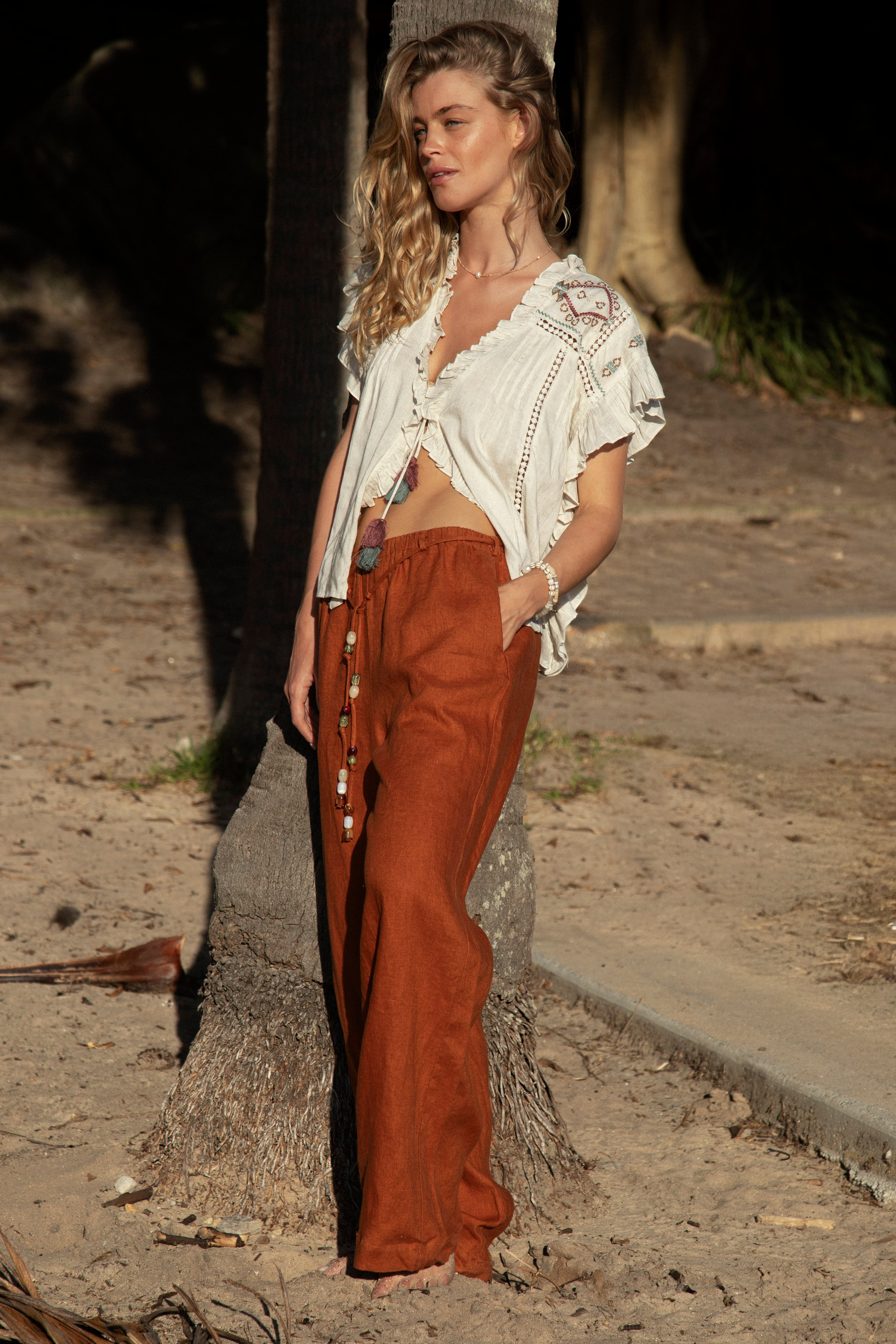Gigi Pant Terracotta showcasing relaxed fit and pockets