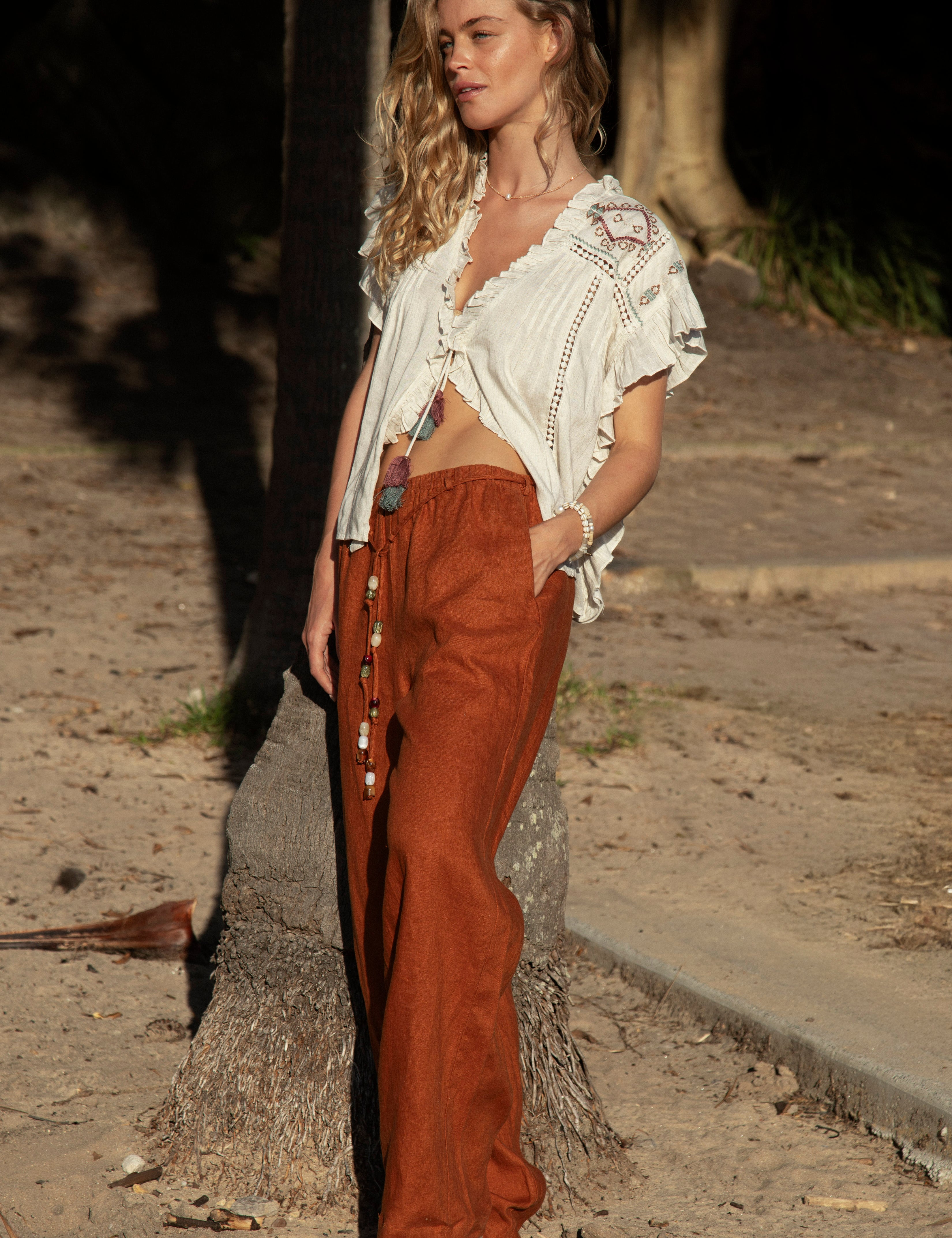 Gigi Pant Terracotta showcasing relaxed fit and pockets